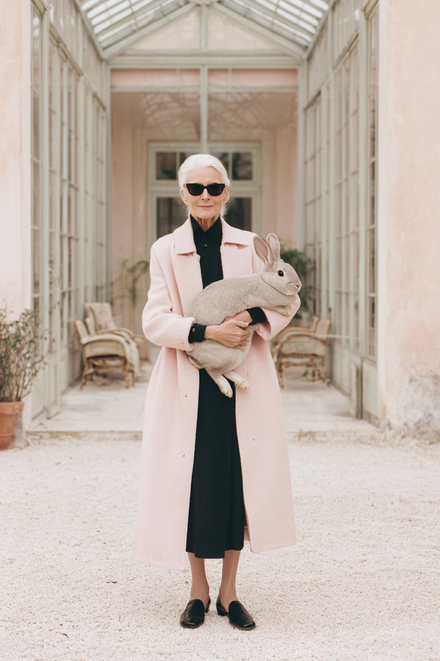 timeless_designers_grandmother_with_her_huge_bunny_and_a_butl_f0b764a0-c65e-4de6-a33d-d0c5d50996e8_1.png