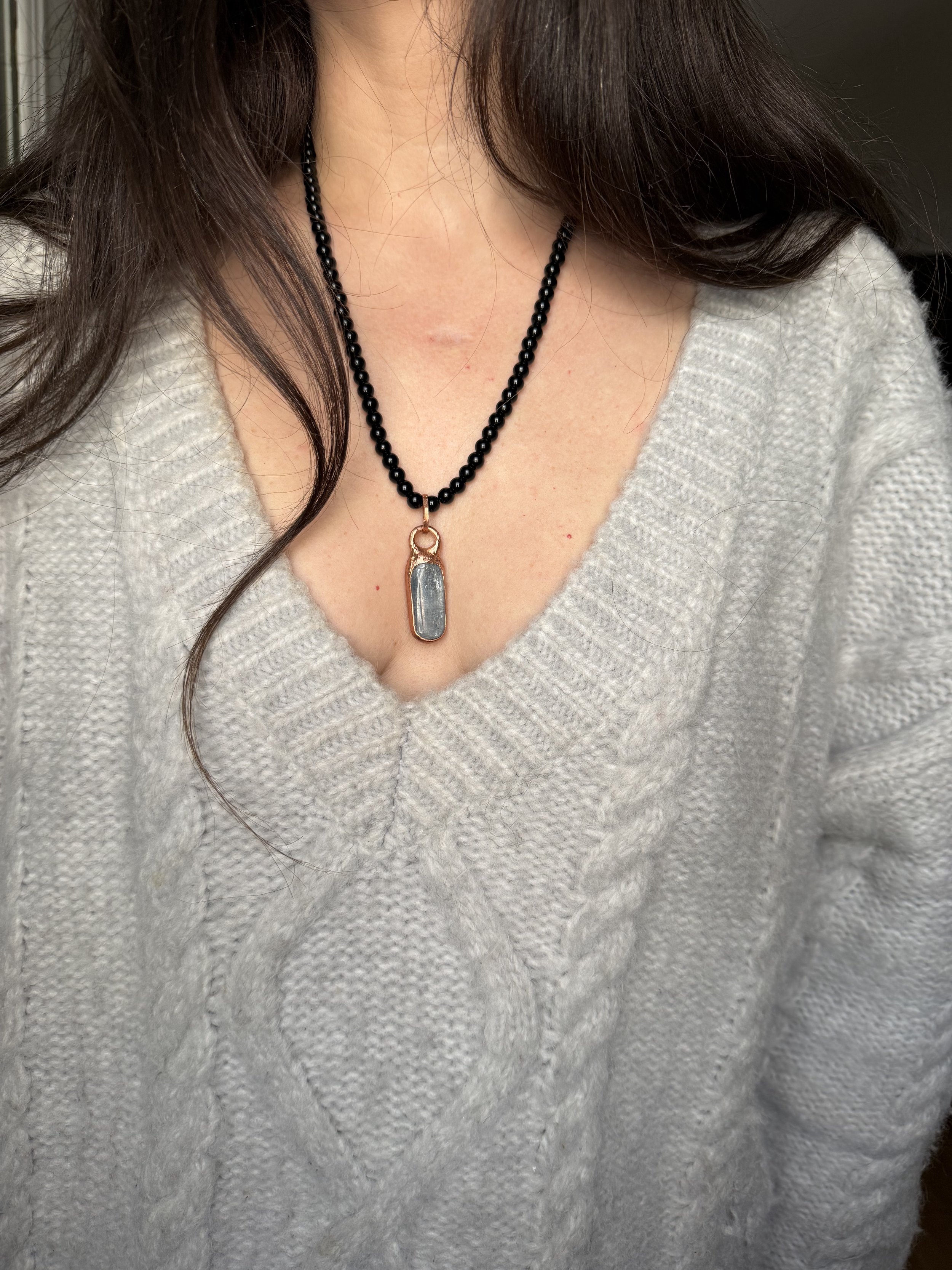 Polished Blue Kyanite Cabochon set in Electroformed Copper on a hand beaded Black Obsidian Necklace finished with Clasp