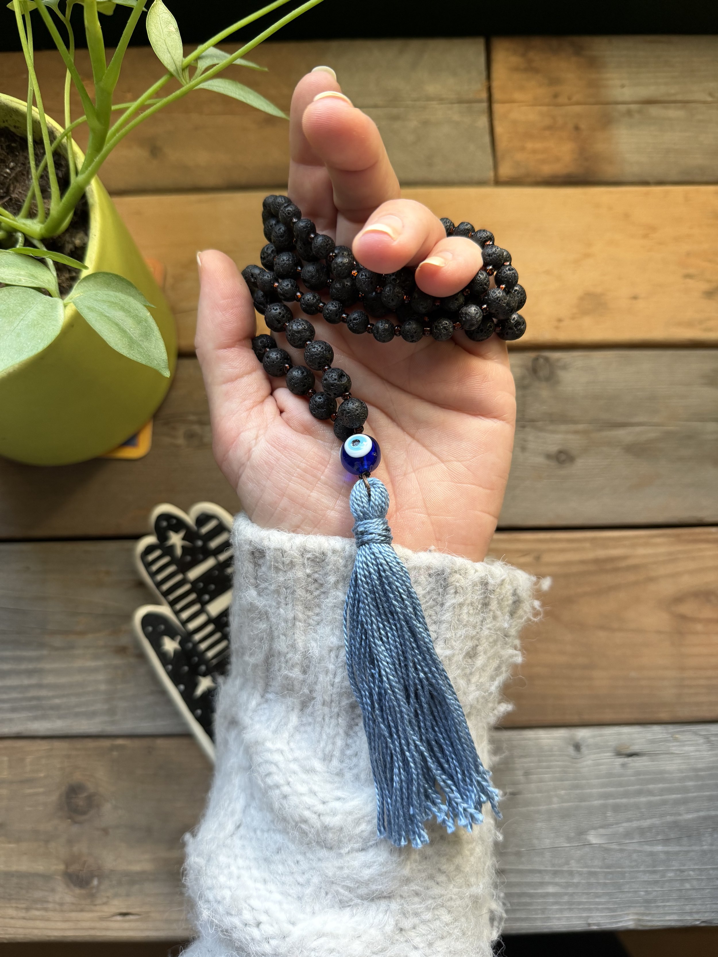 Hand-Beaded Black Lava Male Necklace with Bronze Glass Seed Beads, Evil Eye Guru Bead, and Handmade Cotton Tassel