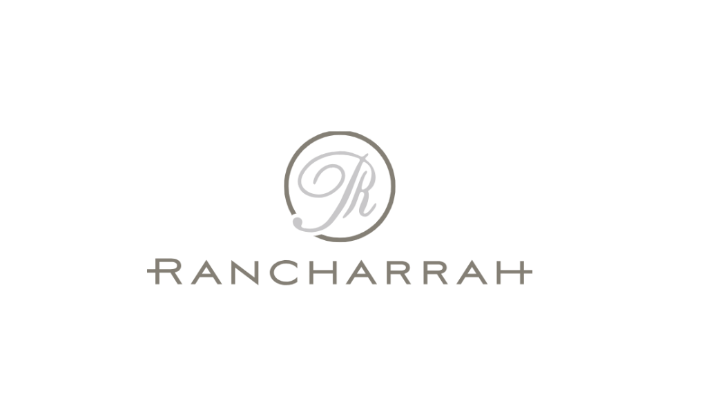 Logo for Rancharah featuring a stylized letter 'R' inside a circular design and the text 'Rancharah' below.