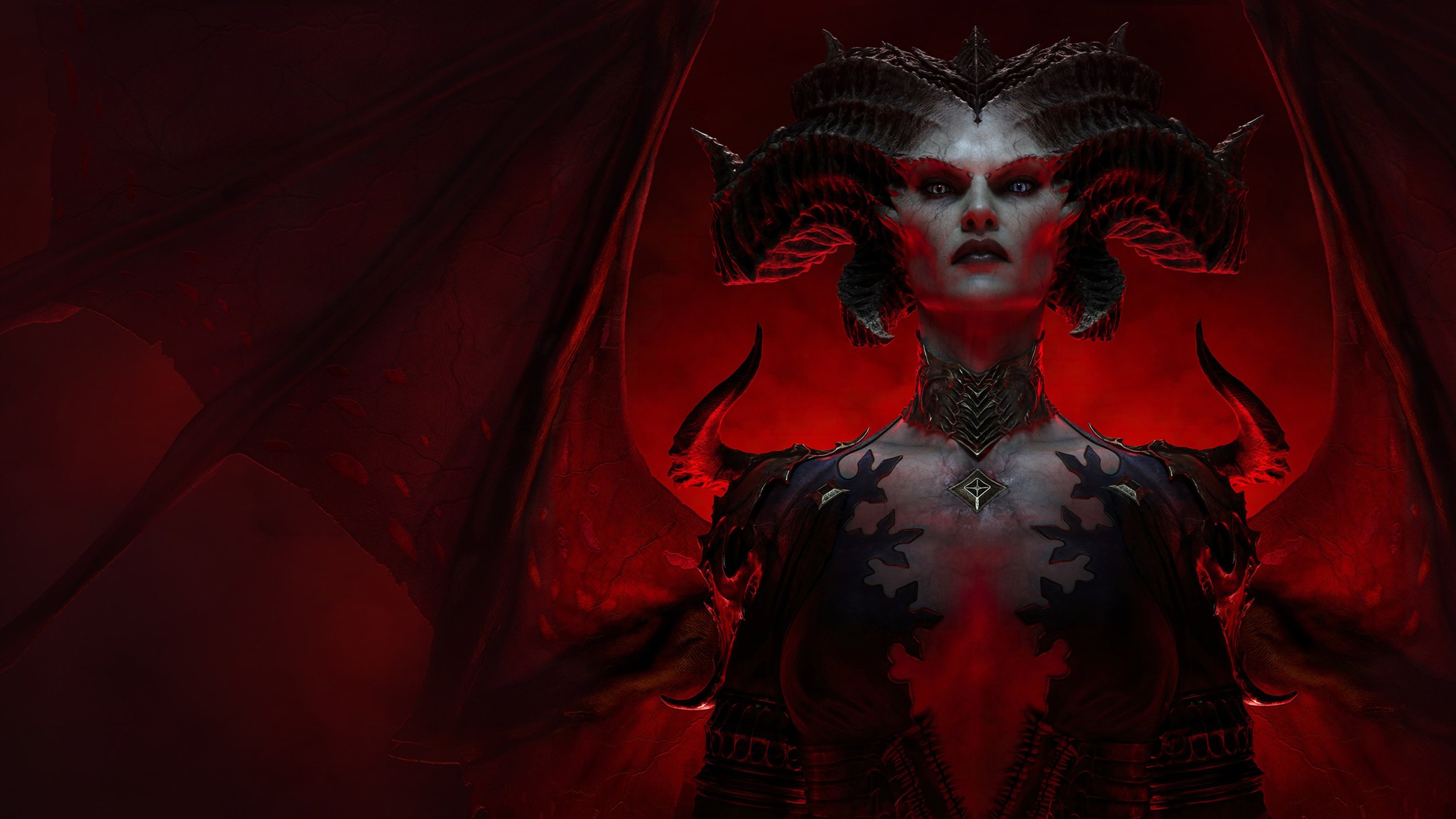A woman dressed as a dark sorceress with black and red armor, horns, and a dramatic headdress, standing against a red-lit background.