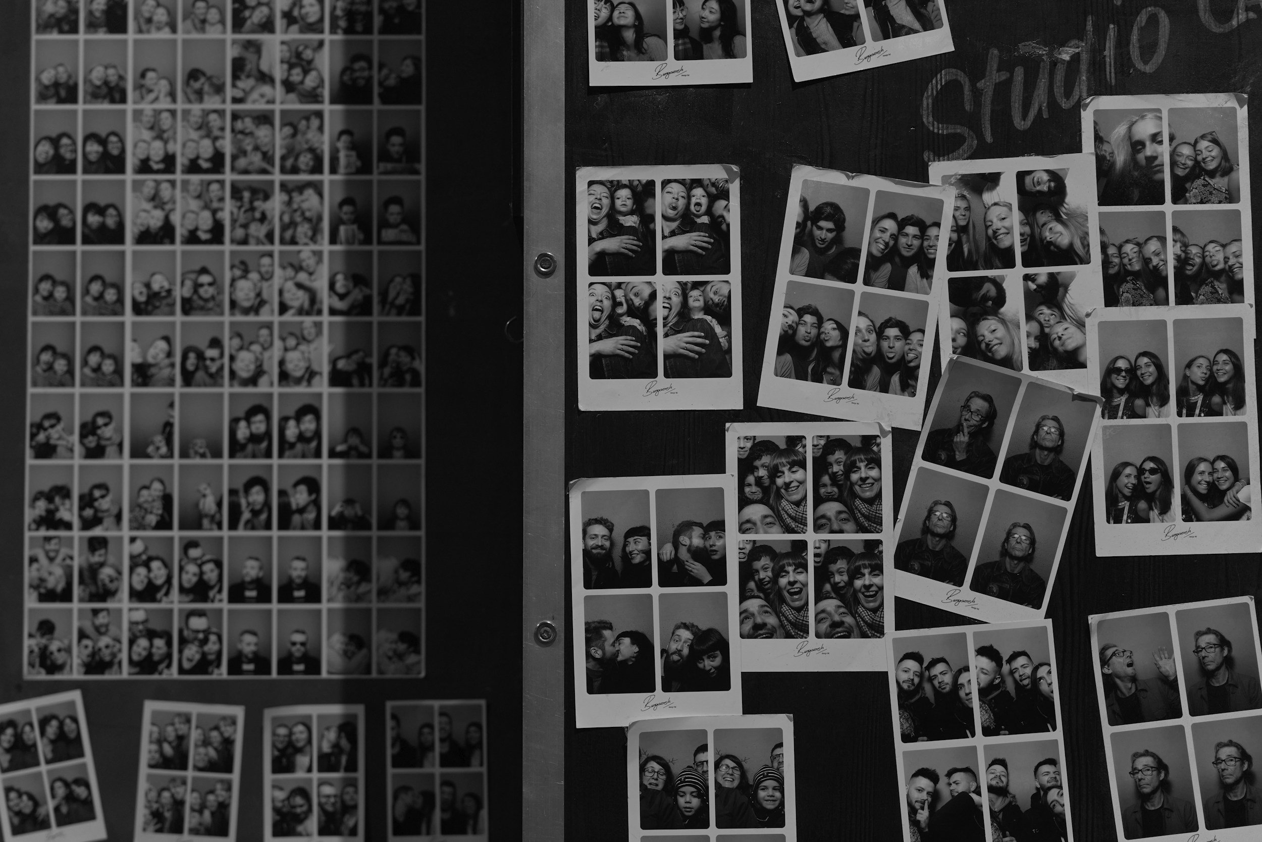 Black rotary dial telephone resting on a white surface.