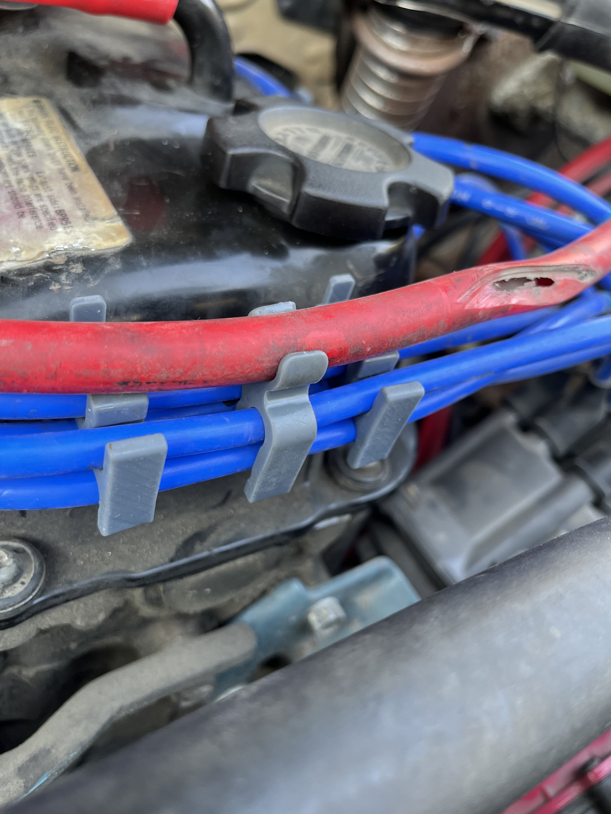 Nissan 720 Carb Vent Hose Holder.jpeg