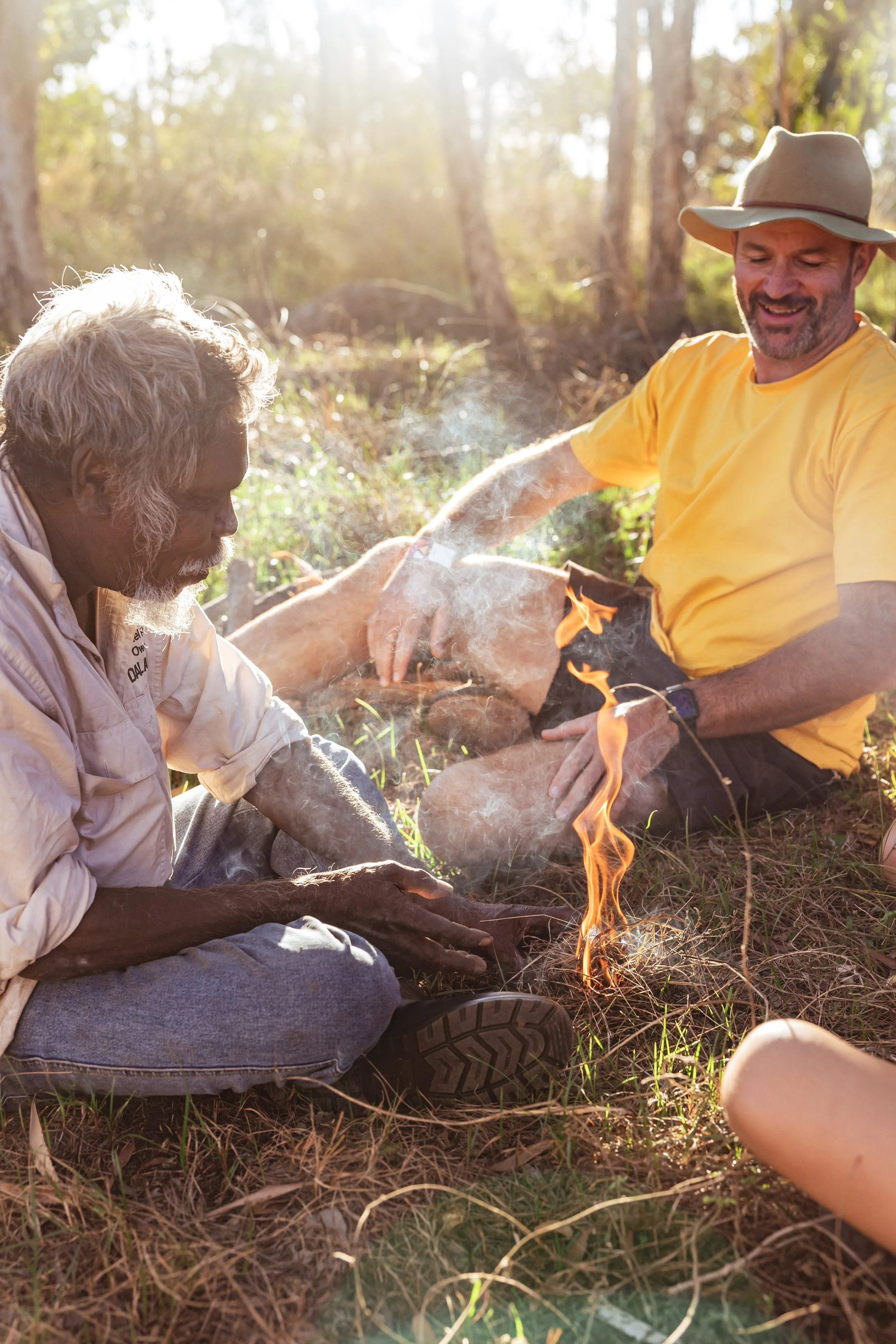Aboriginal tour guide cooks on fire with tourists