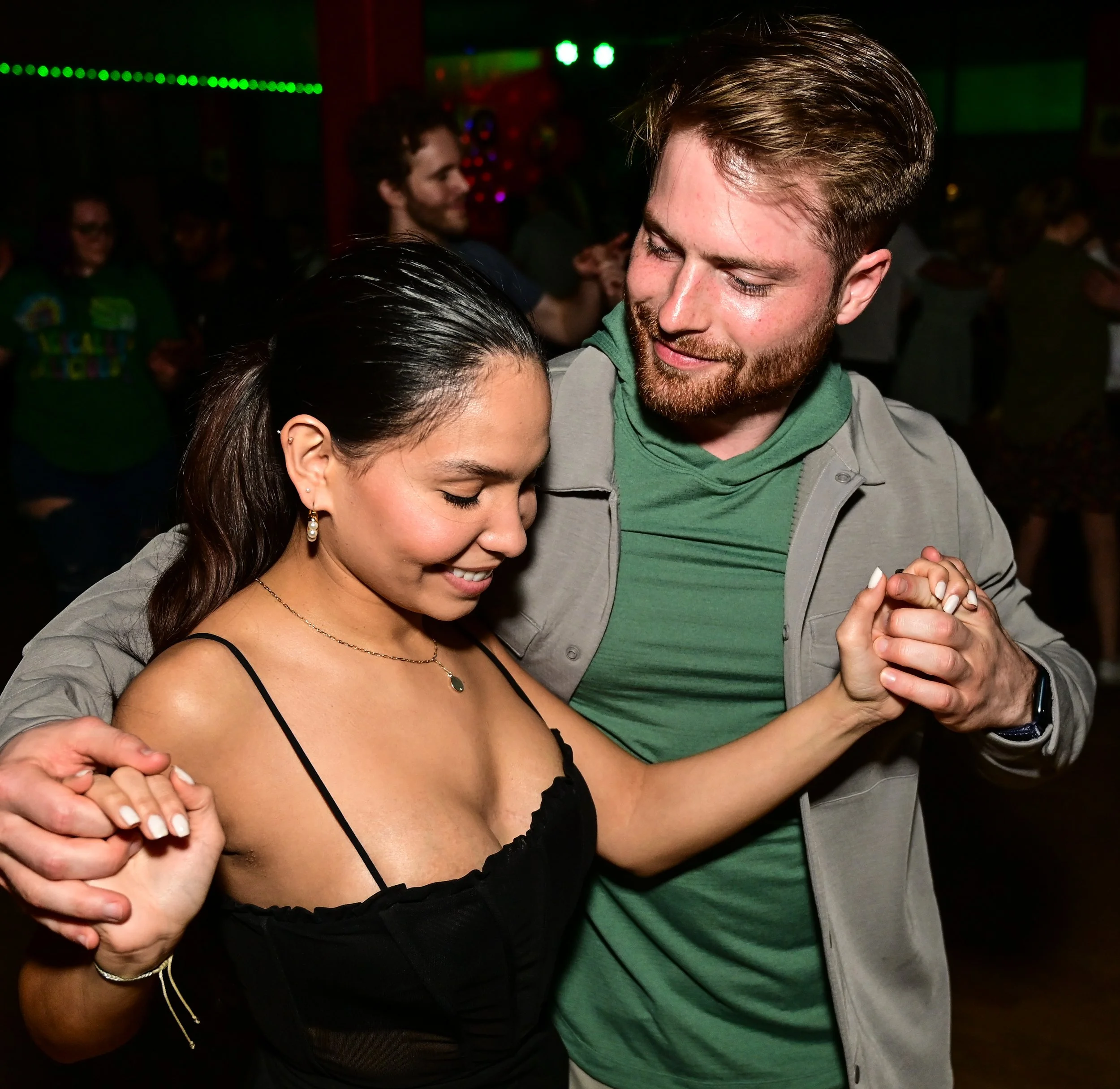 A happy couple dances at a Latin Expressions event. | Latin Expressions Dance Studio Indianapolis