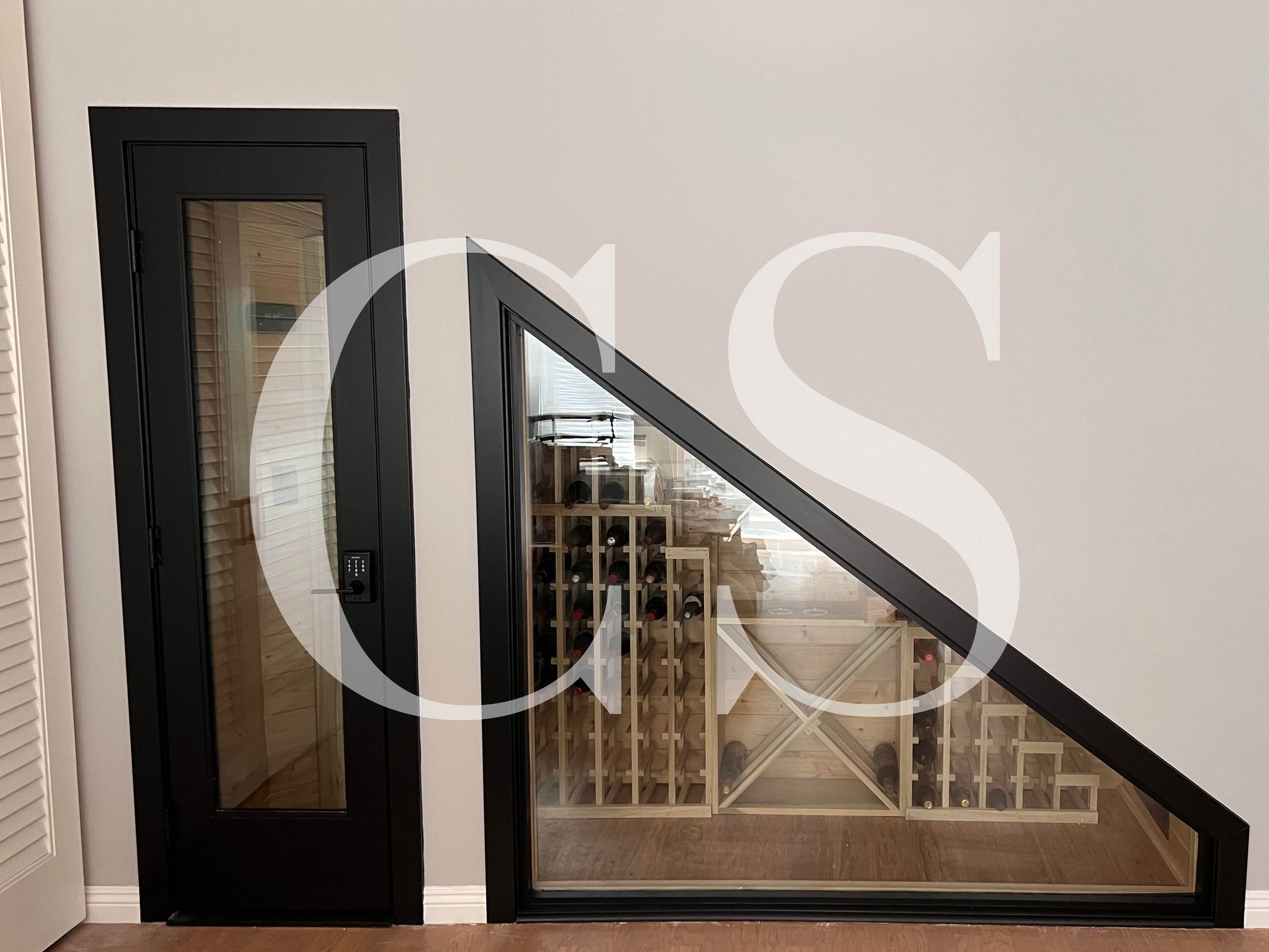 Maximize your space with a custom-built wine cellar under the staircase—where functionality meets elegance.