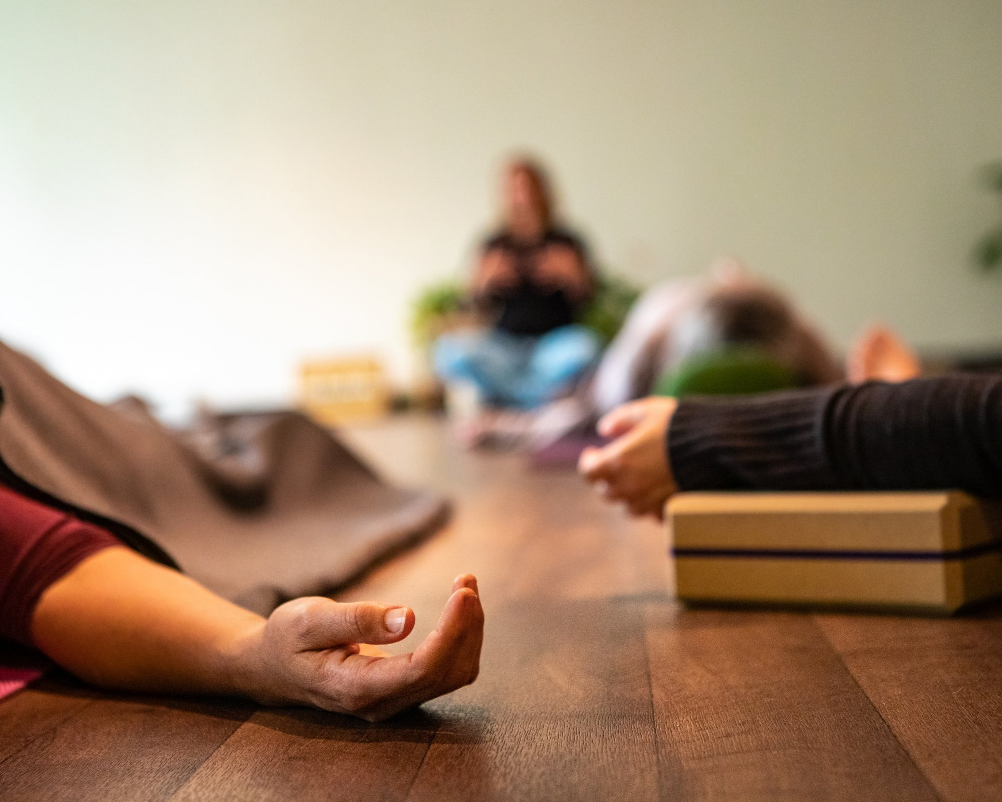 People in a studio during energy aware overhead meditation.