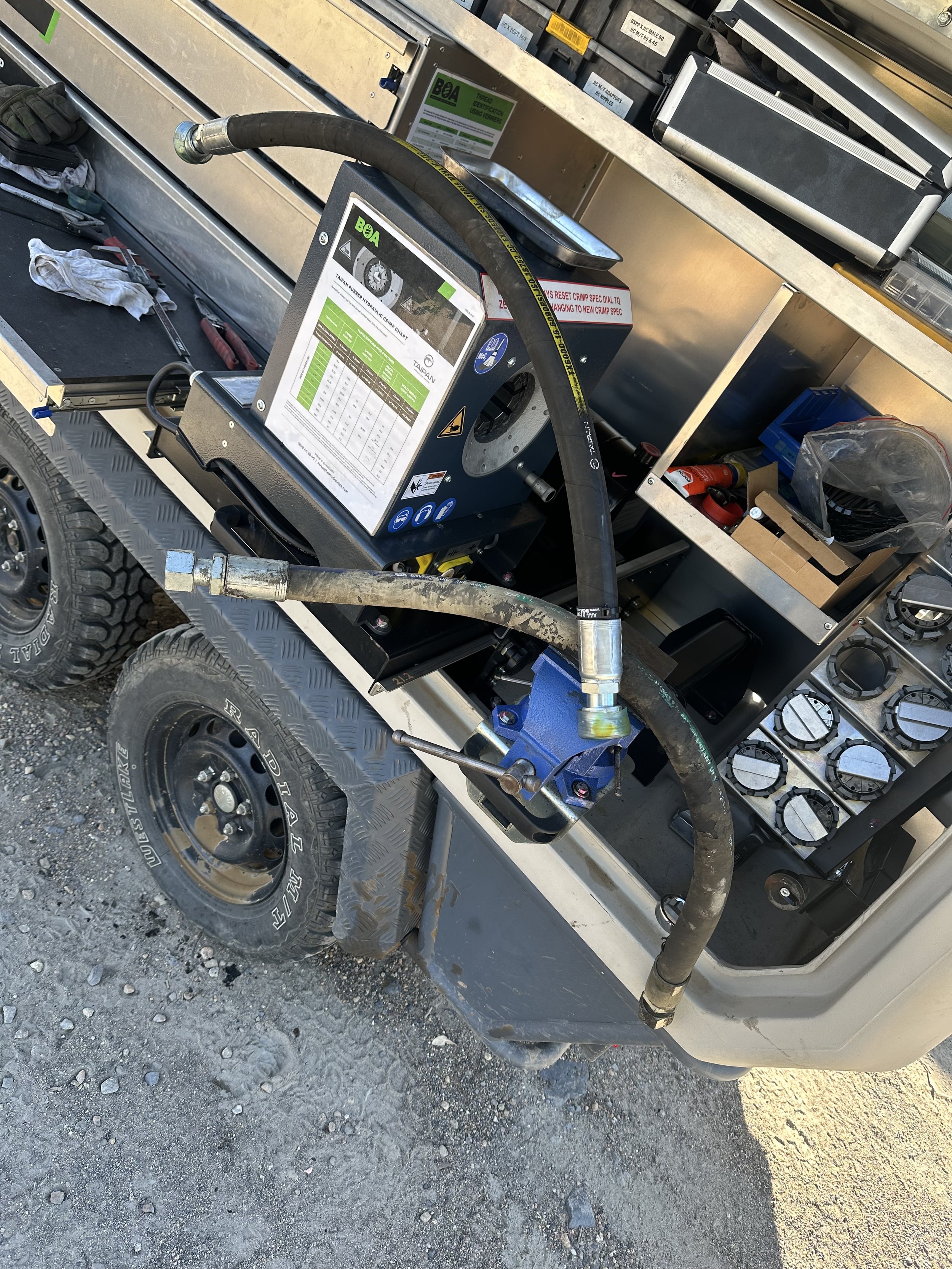 Mobile hose crimping machine setup on utility trailer
