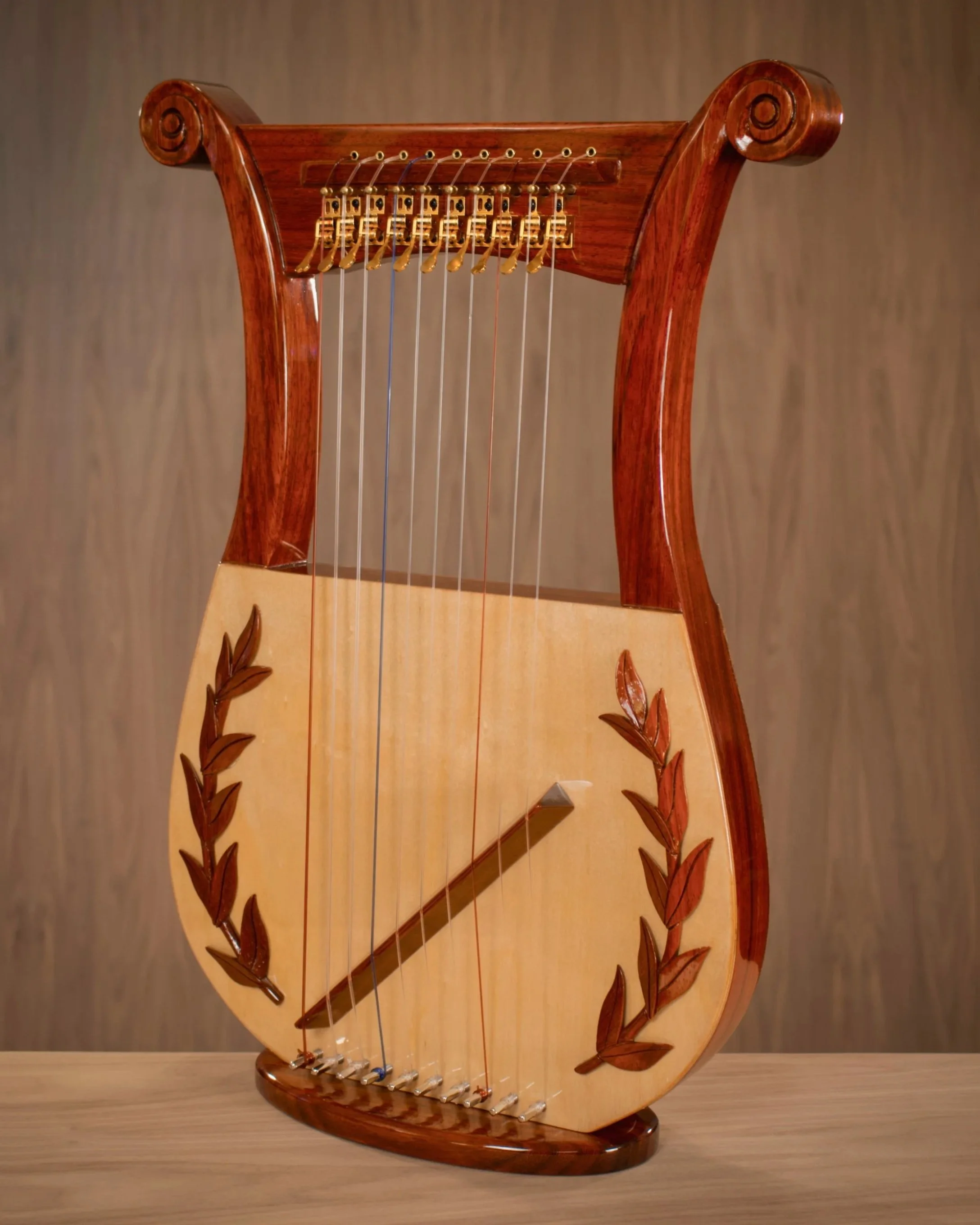 10-Davidic | Padauk | High-gloss | Levers w. modified neck | Carved scrolls + Olive branches