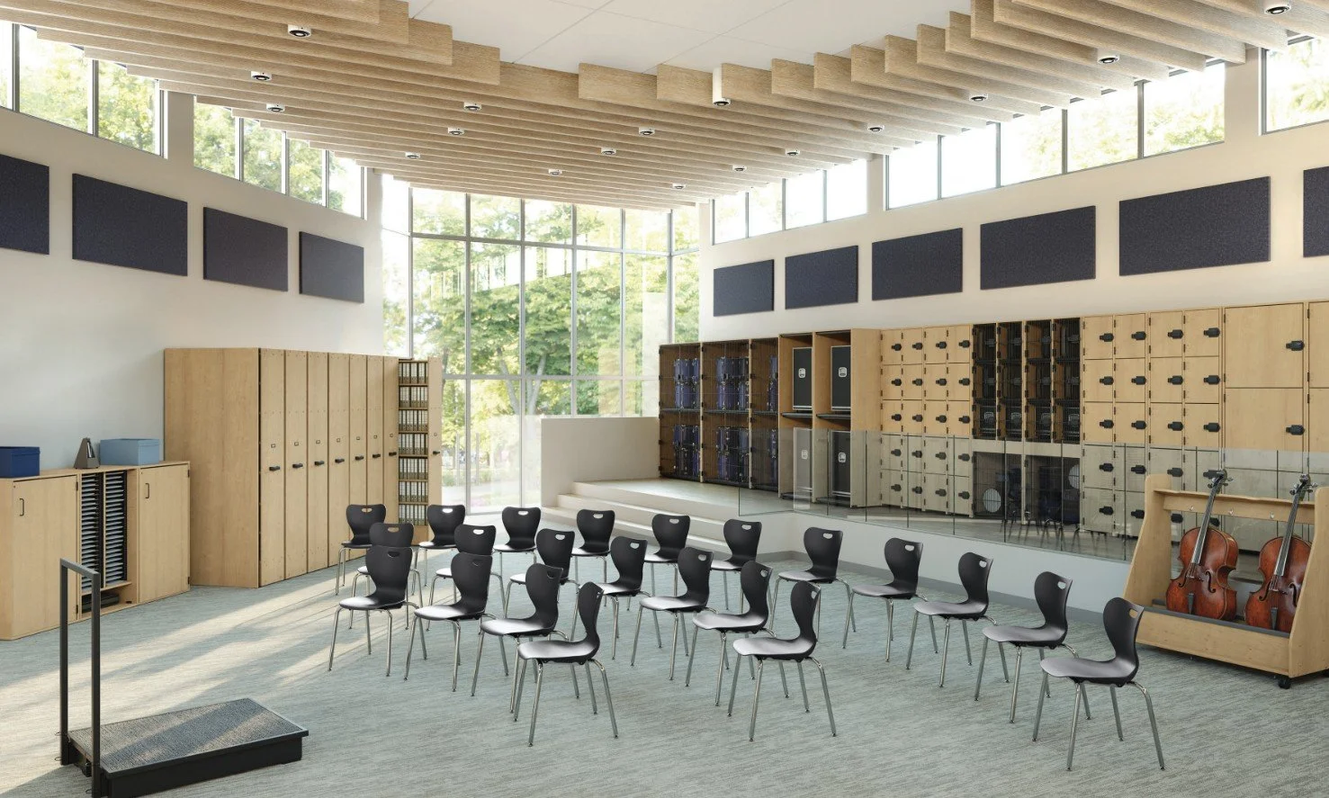 A modern music classroom with black chairs arranged in rows, large windows letting in natural light, musical lockers, and instrument storage, including violins and music stands.