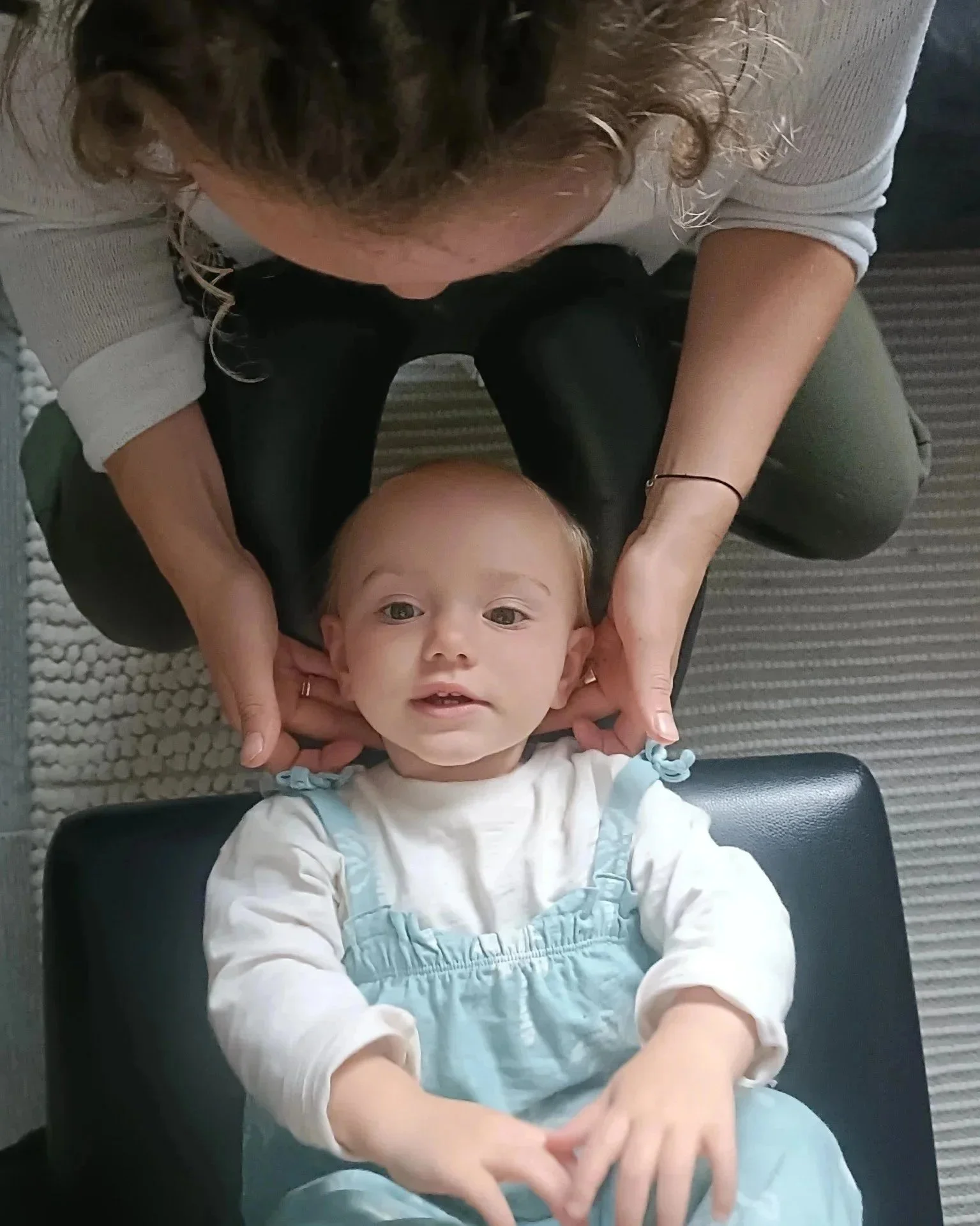 Gentle chiropractic adjustment on a baby in Ascot Berkshire | Hope Chiropractic