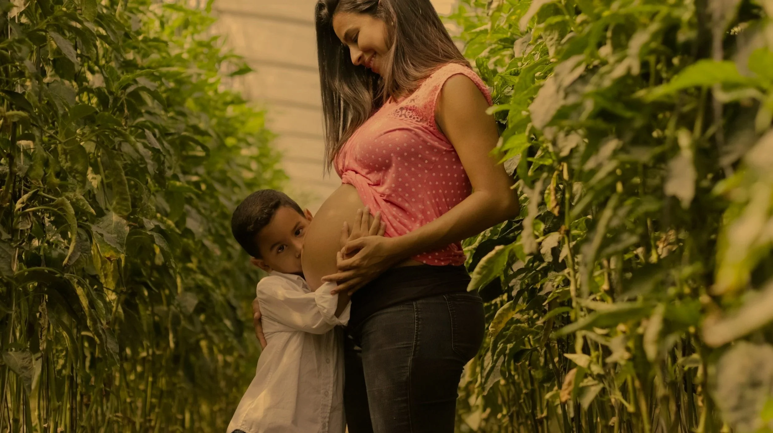 pregnant mum with older child after chiropractic care in Windsor