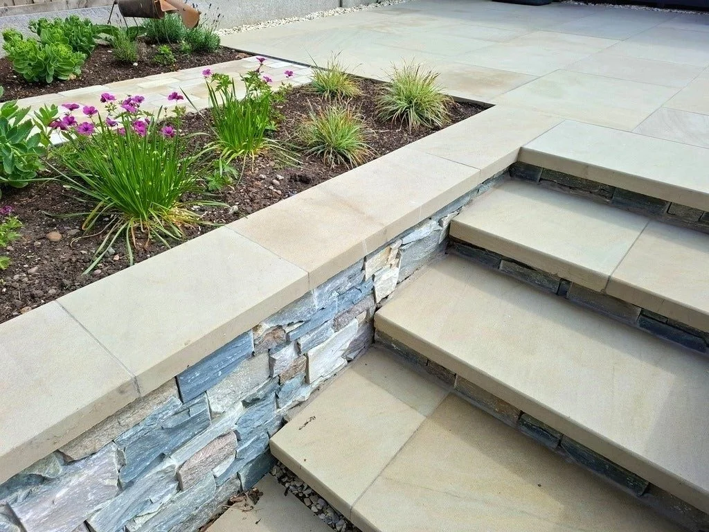 Some lovely materials in this garden in Nailstone, Sawn Yorkstone Pavers, Sandstone Setts and Wild Stone Panelling to clad the walls. The grey-buff tones of the cladding tie in with the clients existing Summerhouse to give a cohesive feel.