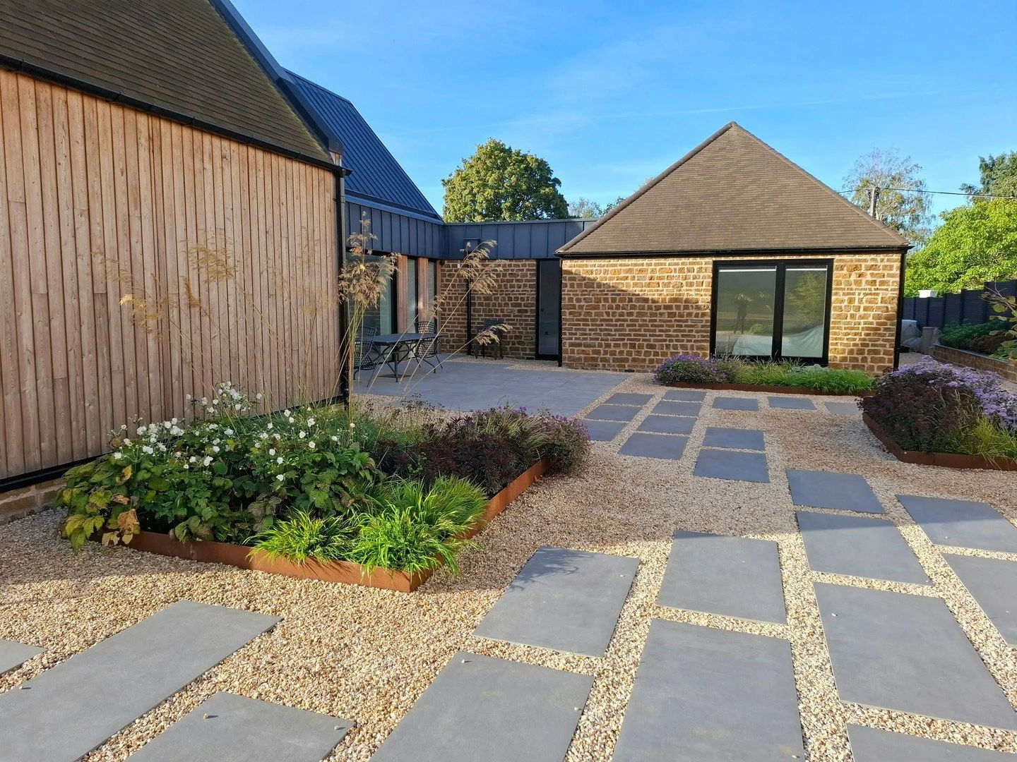 When architecture and garden design combine to create the courtyard of dreams!  One year on from completion the planting is bringing dynamic texture and softness to the space.