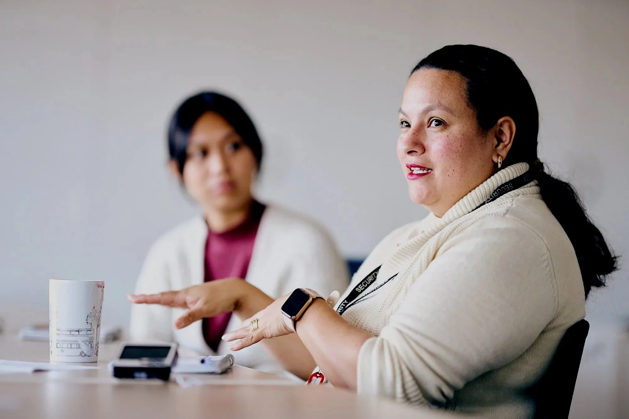 RCSL training discussion with two women in a meeting room,