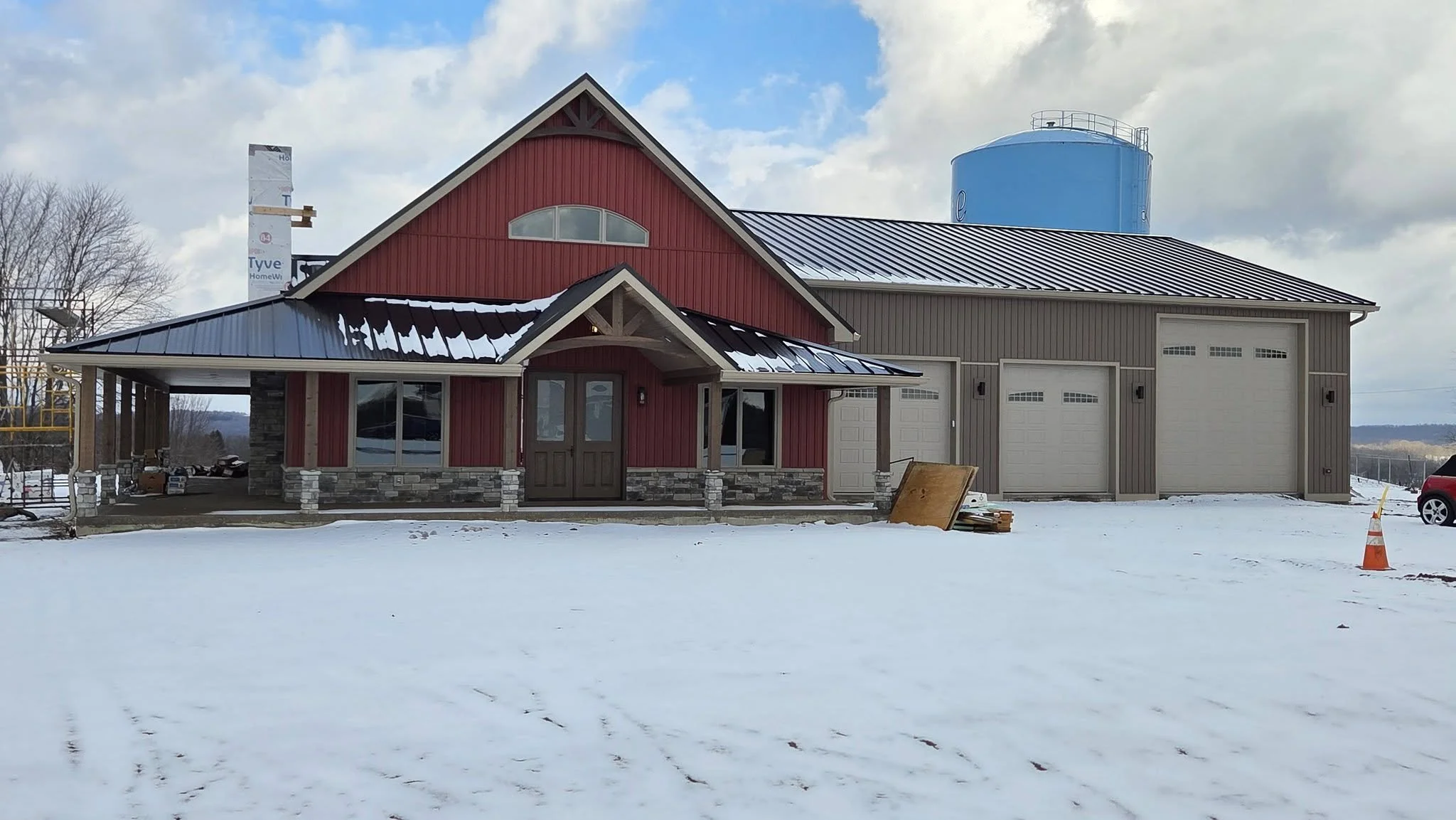 Custom home with attached 2400 square foot garage nearing completion in a rural setting
