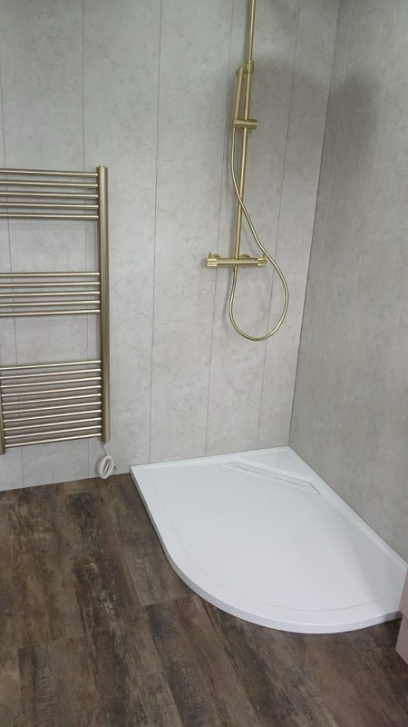 Stylish bathroom remodel featuring updated tiling, and contemporary fixtures by Broadoak Construction Services.