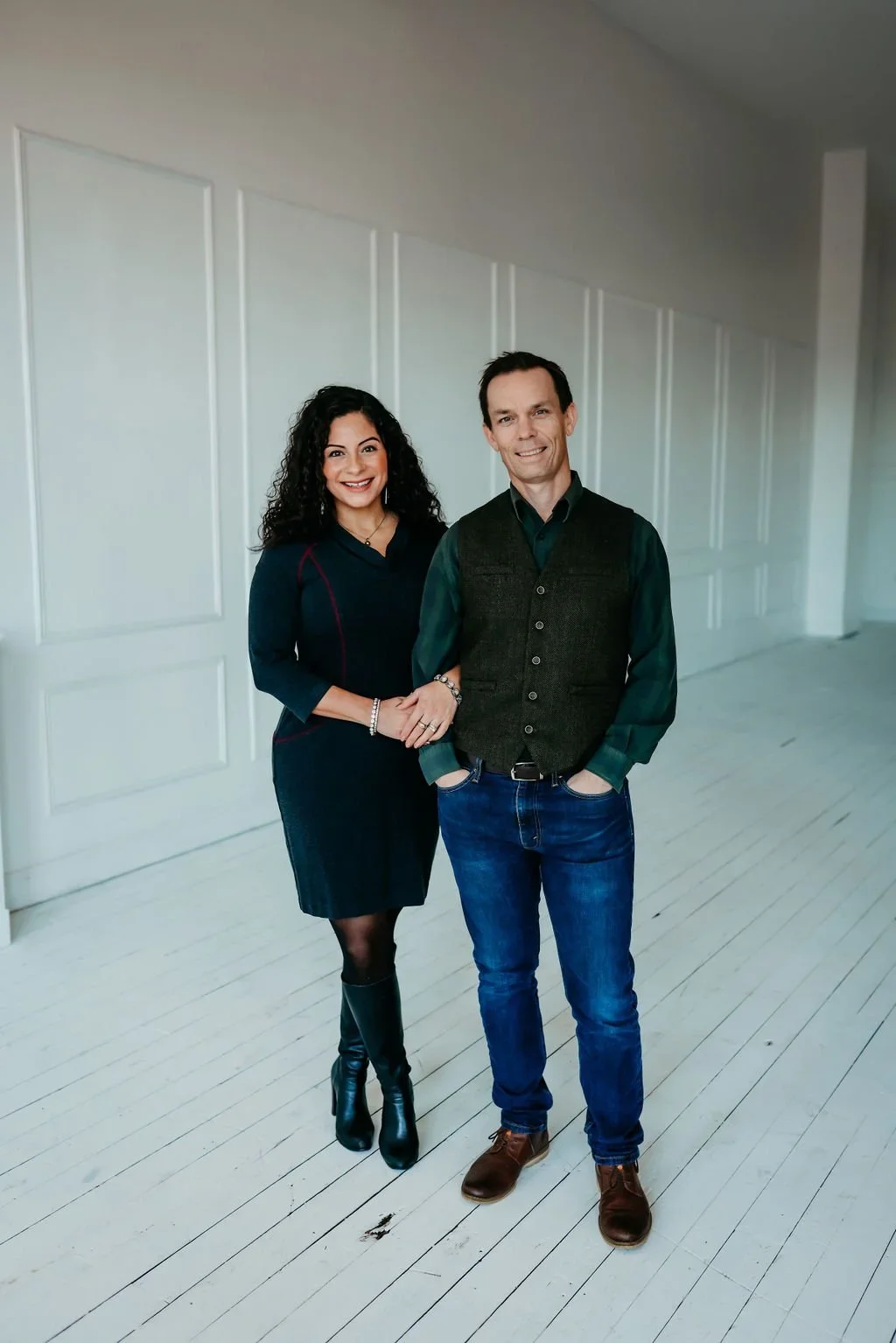 Jenna and Brad Clarke, founders of The Surrogacy Co., a boutique surrogacy agency focused on high-touch, founder-level case management, posing hand in hand.