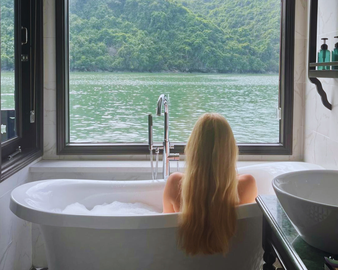 Blonde lady looking out from bath in Vietnam