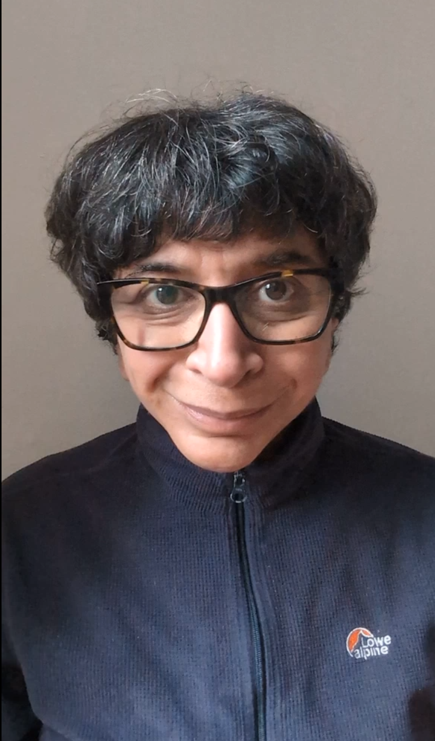 Woman with dark hair and glasses