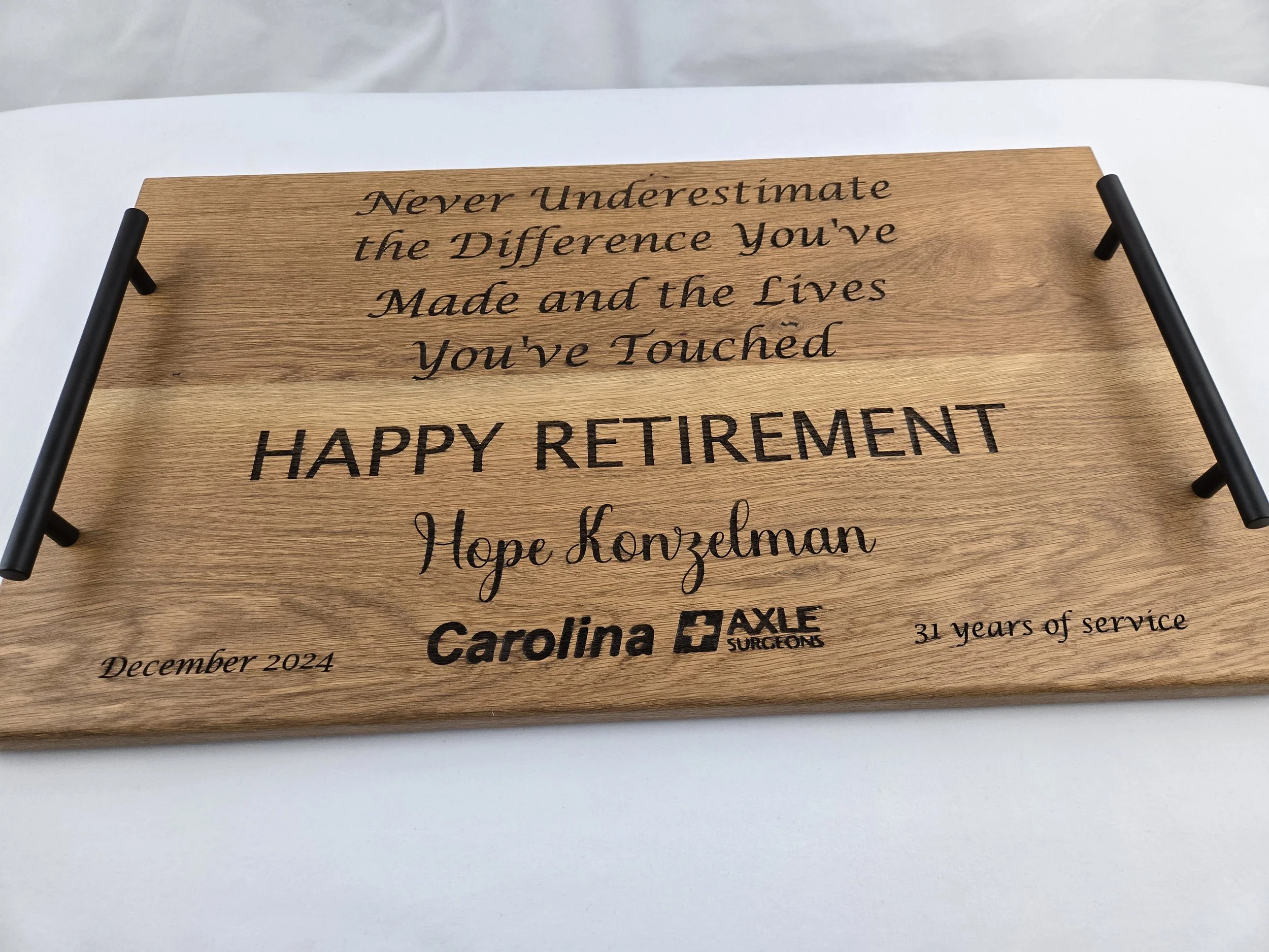 Custom etched oak serving tray as a retirement gift.