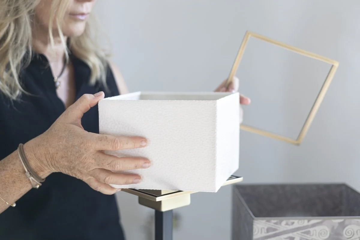 Hands assembling the DOGIA interchangeable shade, Folding Shade System, design protected