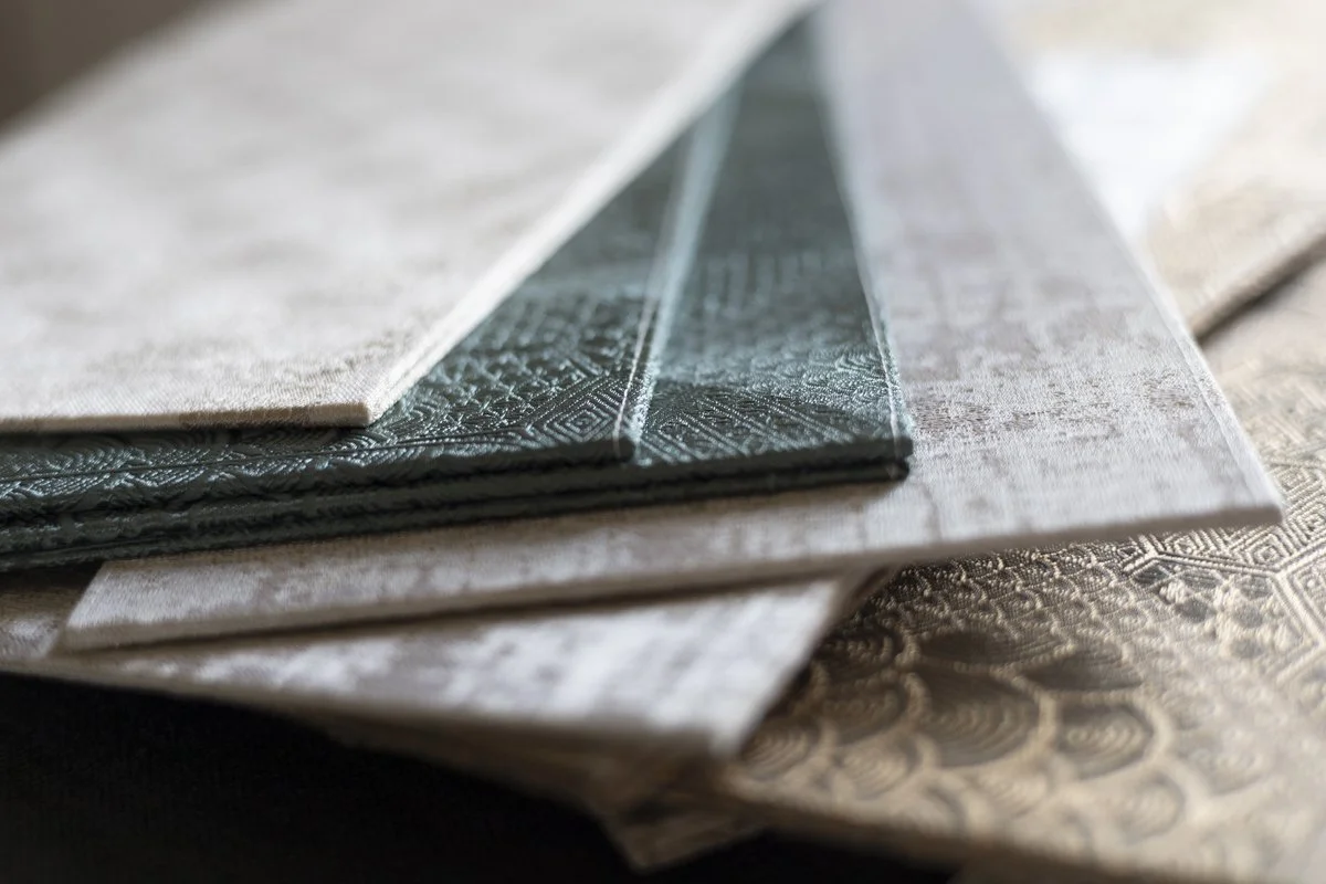  DOGIA Shade Editions, folded fabric folios in neutral tones, Venetian textile art
