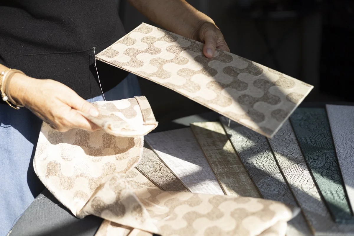 Gianna Alberi presenting a DOGIA Shade Edition folded flat, Rubelli textile
