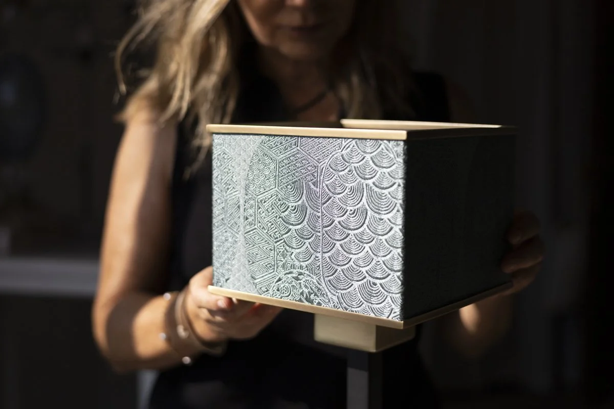 Gianna Alberi presenting DOGIA's Folding Shade System with a rare, no-longer-produced Rubelli fabric