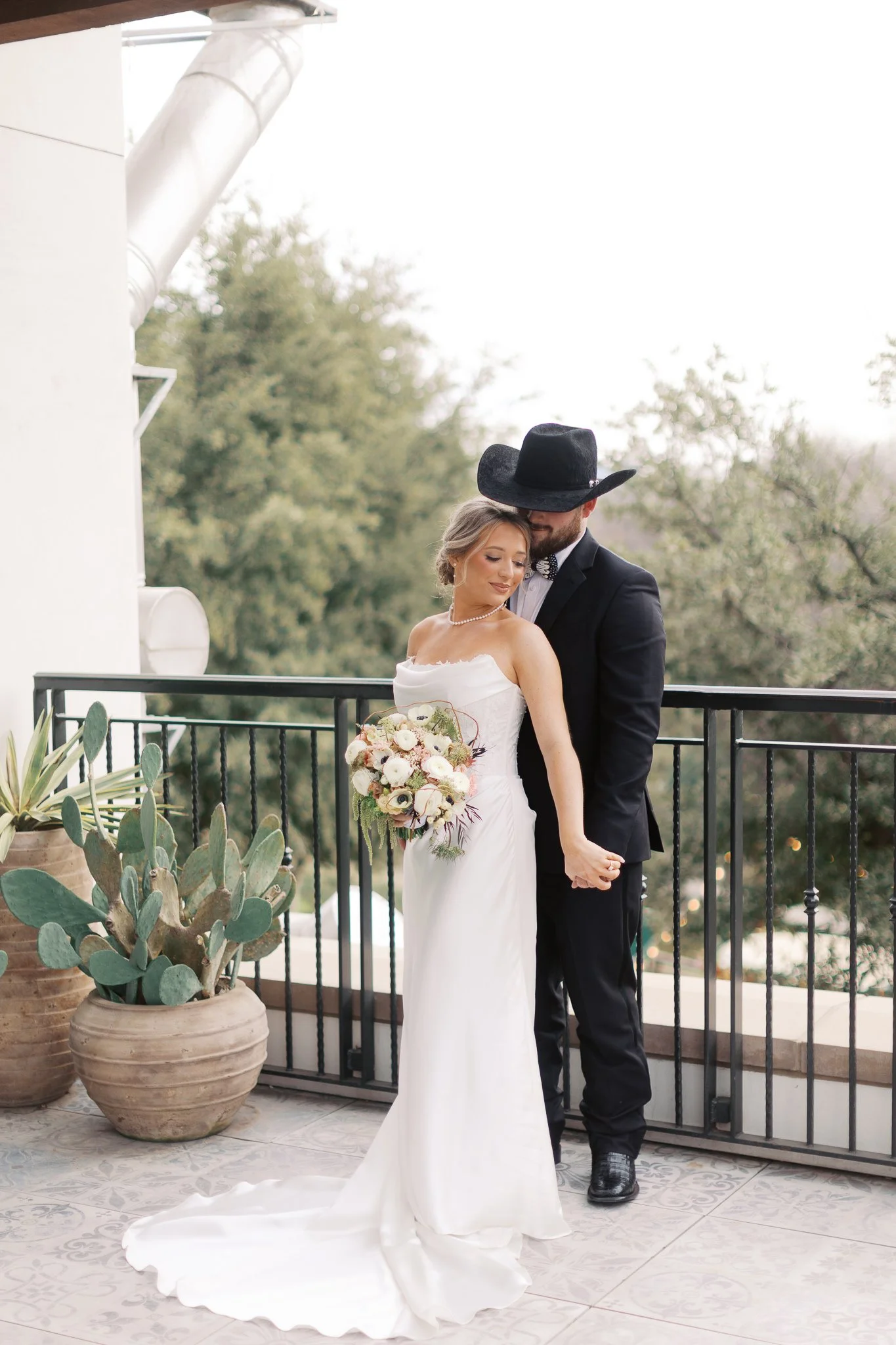 Five-star wedding review from Emma and Trevor describing their experience working with Divine Works Event Company at Hotel Drover and expressing gratitude for a smooth, stress-free, and beautifully executed wedding day.