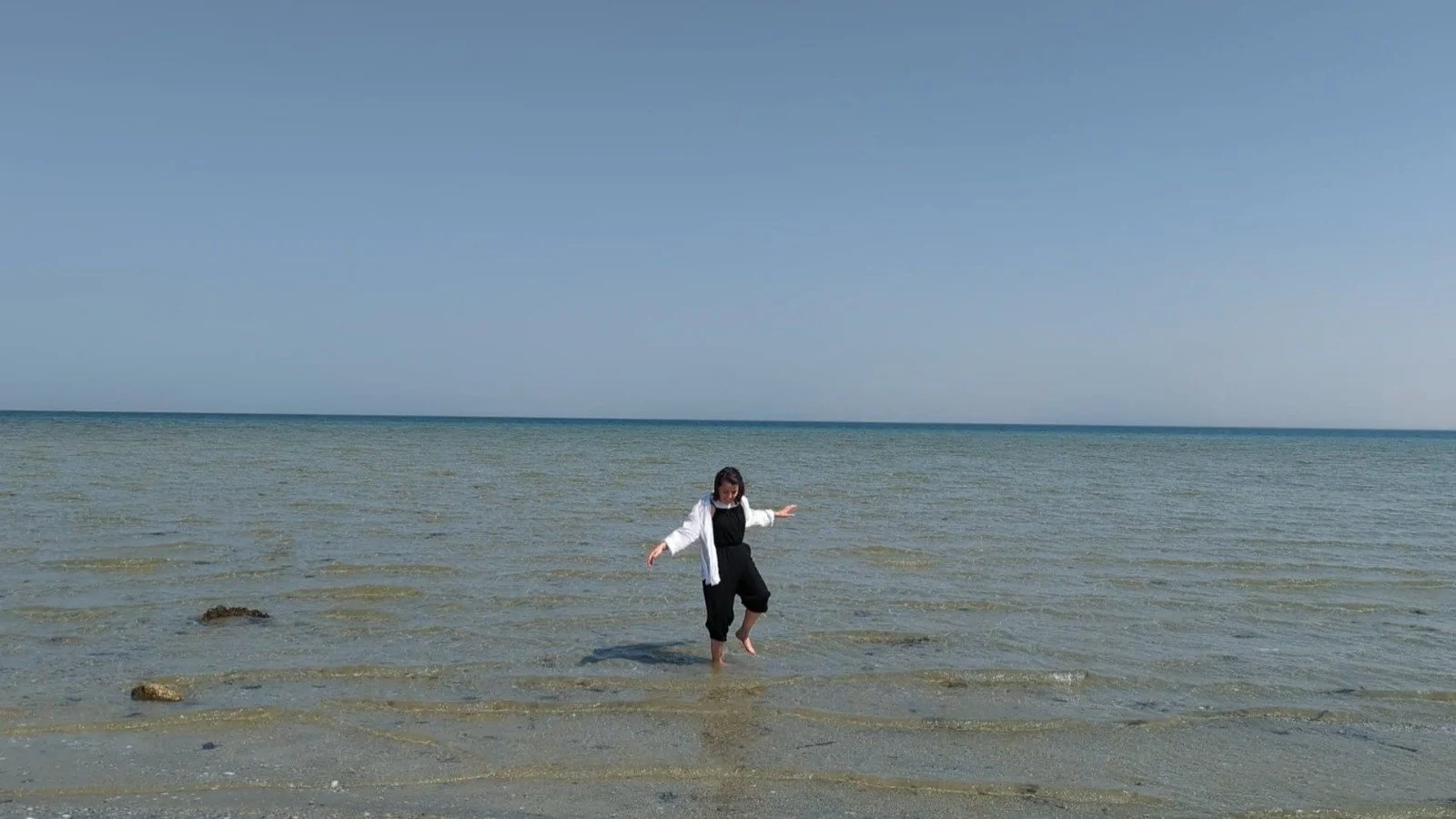 Splashing on the beach in a site visit to Saudi Arabia.