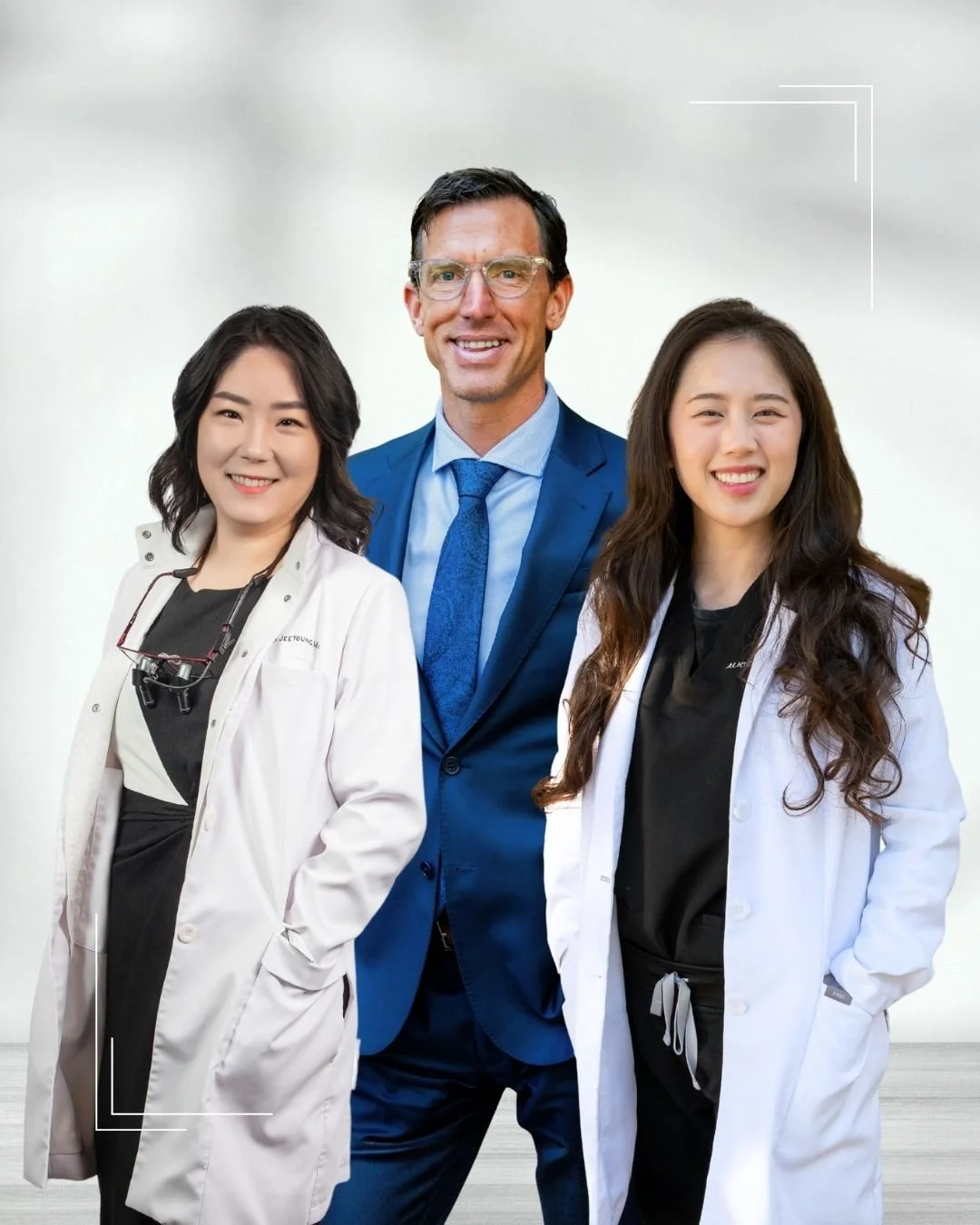 Dr. Han, Dr. DeLong, and Dr. Nyguen standing smiling at the camera