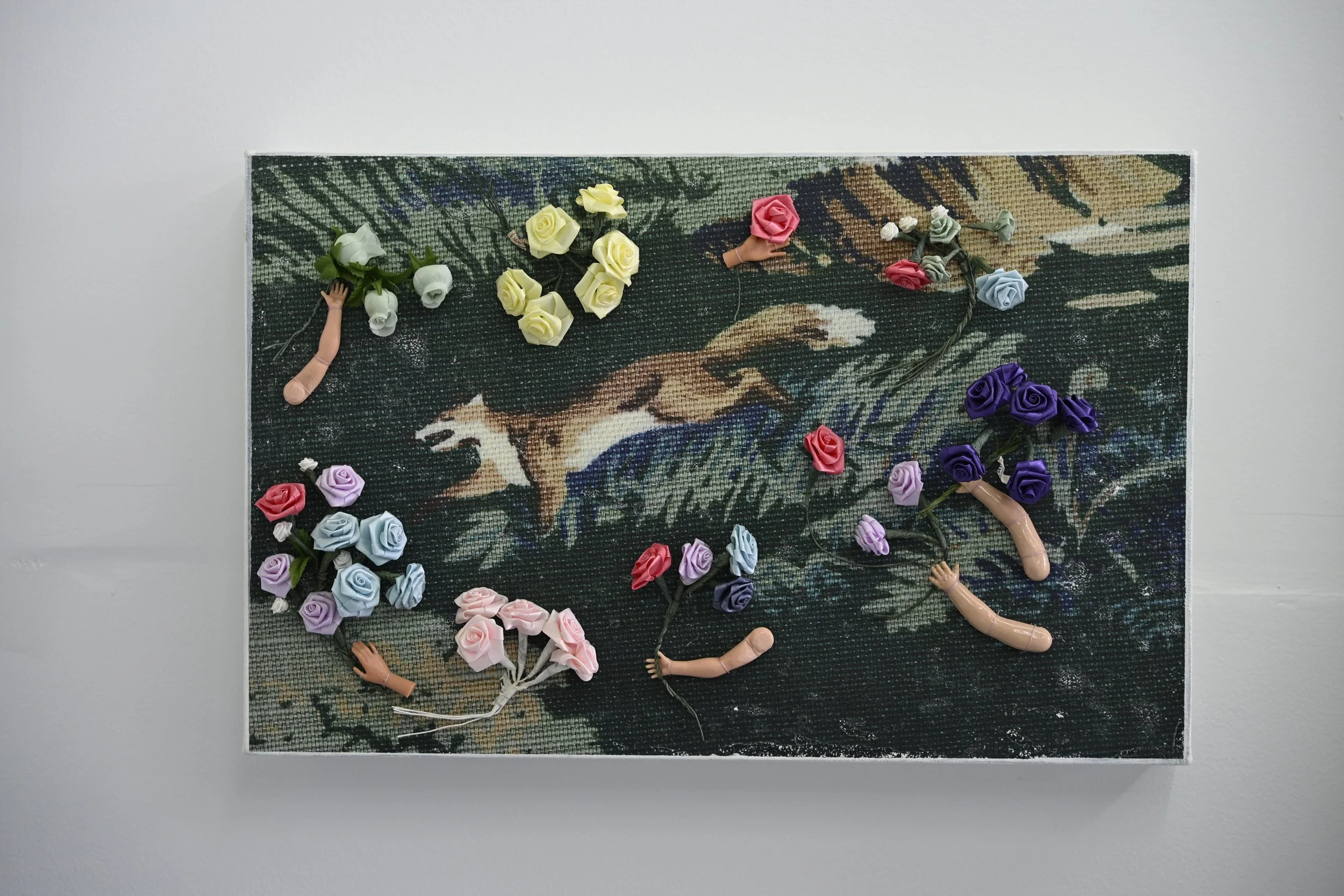 The Hunt / 2025 / Acrylic transfer, fabric and wire flowers, doll hands, thread on canvas / 11” x 17” / $1200