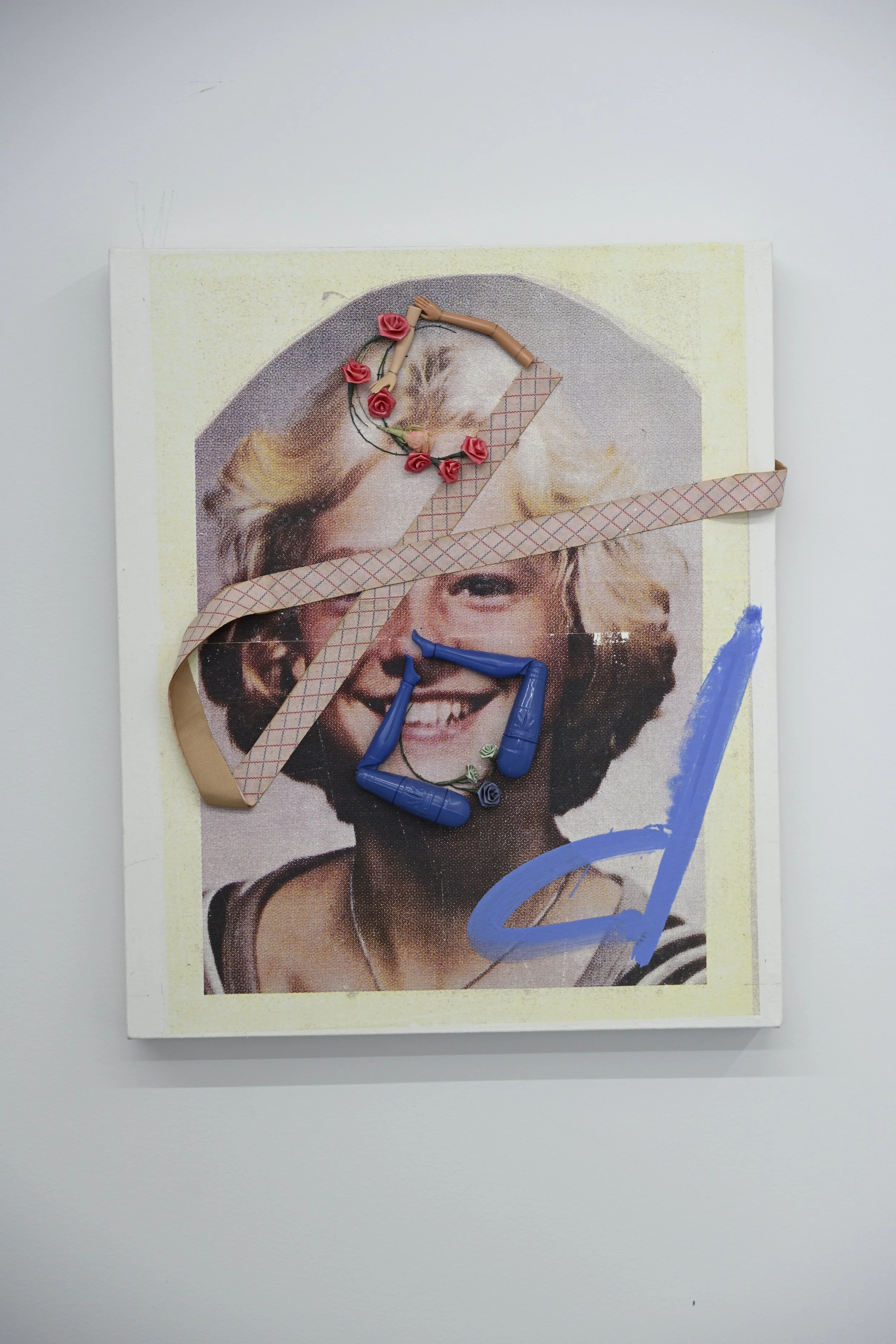 God Girl / 2026 / oil, acrylic transfer, fabric flowers, doll parts, vintage ribbon, thread on canvas / 22” x 18 1/2” / $1400