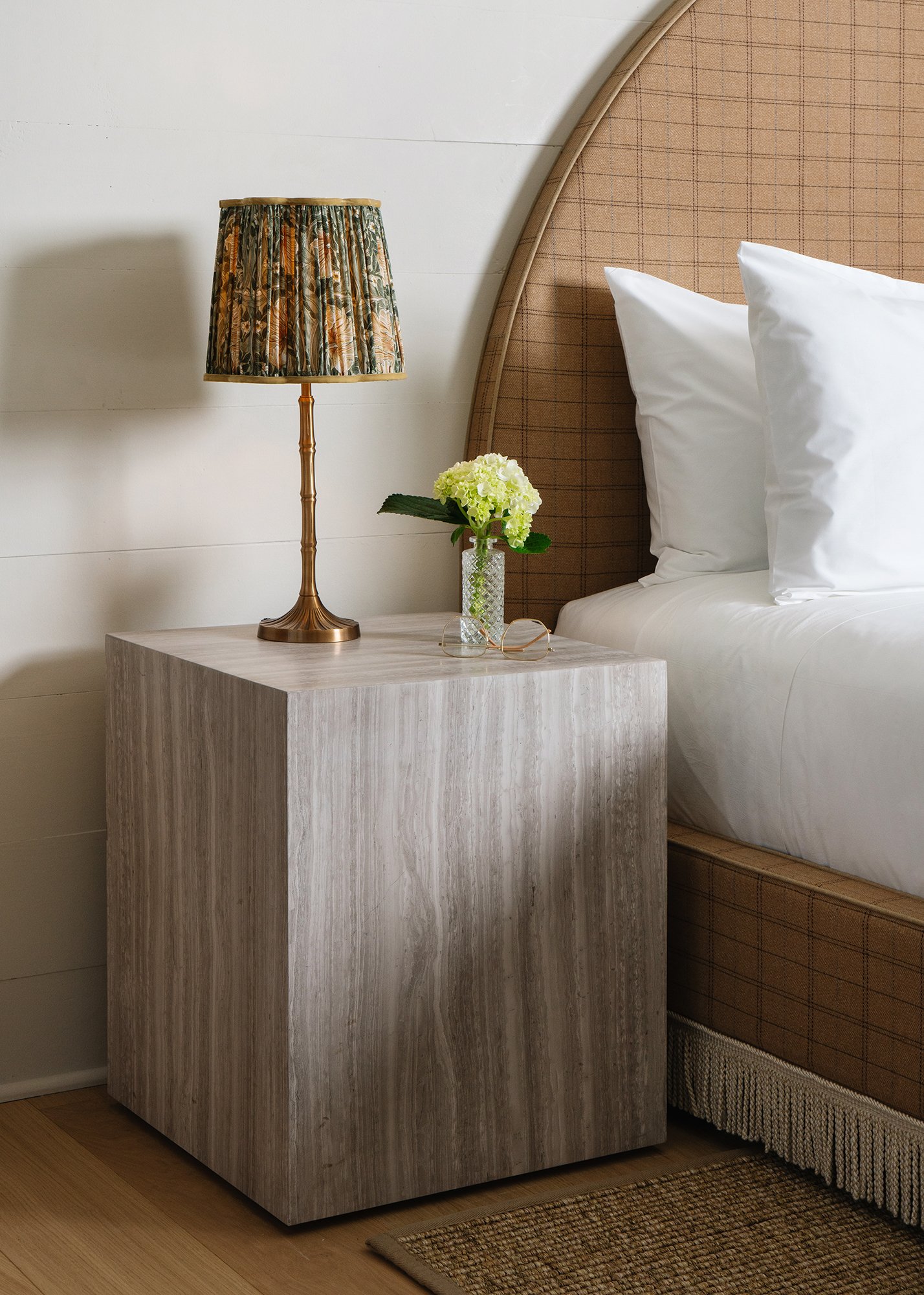 Three quarter view of travertine Orlando Bedside Table