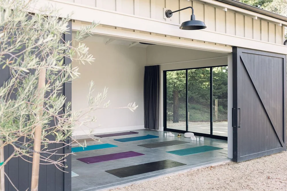 The barn studio with yoga mats laid out