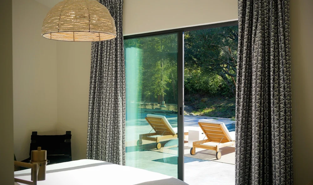 A bright room opening onto the pool deck