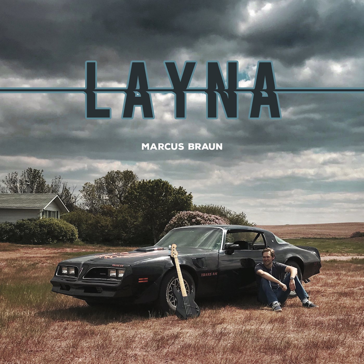 Album cover for "Layna" by Marcus Braun, showing a man sitting beside a black Pontiac Trans Am in a field under dark clouds, with a guitar leaning against the car and trees in the background.