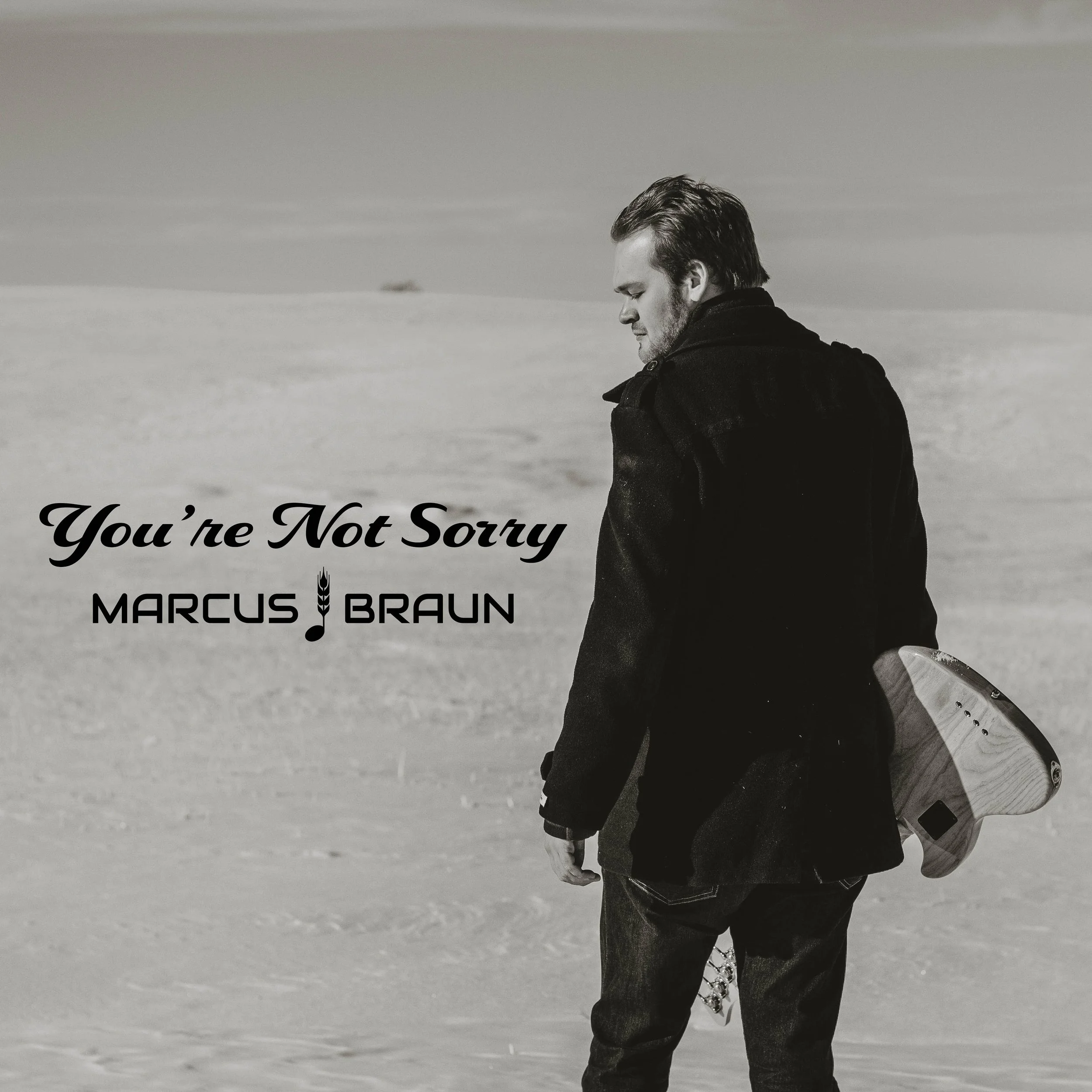 A man standing in a snowy landscape holding a skateboard, with the words "You're Not Sorry" and "Marcus Braun" on the left side of the image.