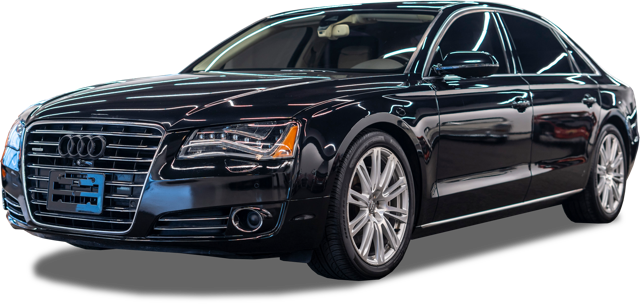 Black Audi sedan with chrome trim and alloy wheels, front grille and headlights visible.