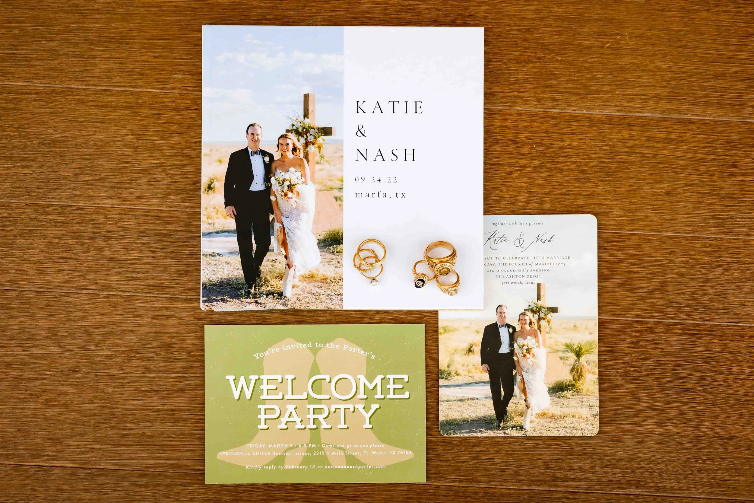 Wedding invitation suite including a photo of the bride and groom outdoors, a wedding welcome party card, and wedding rings.