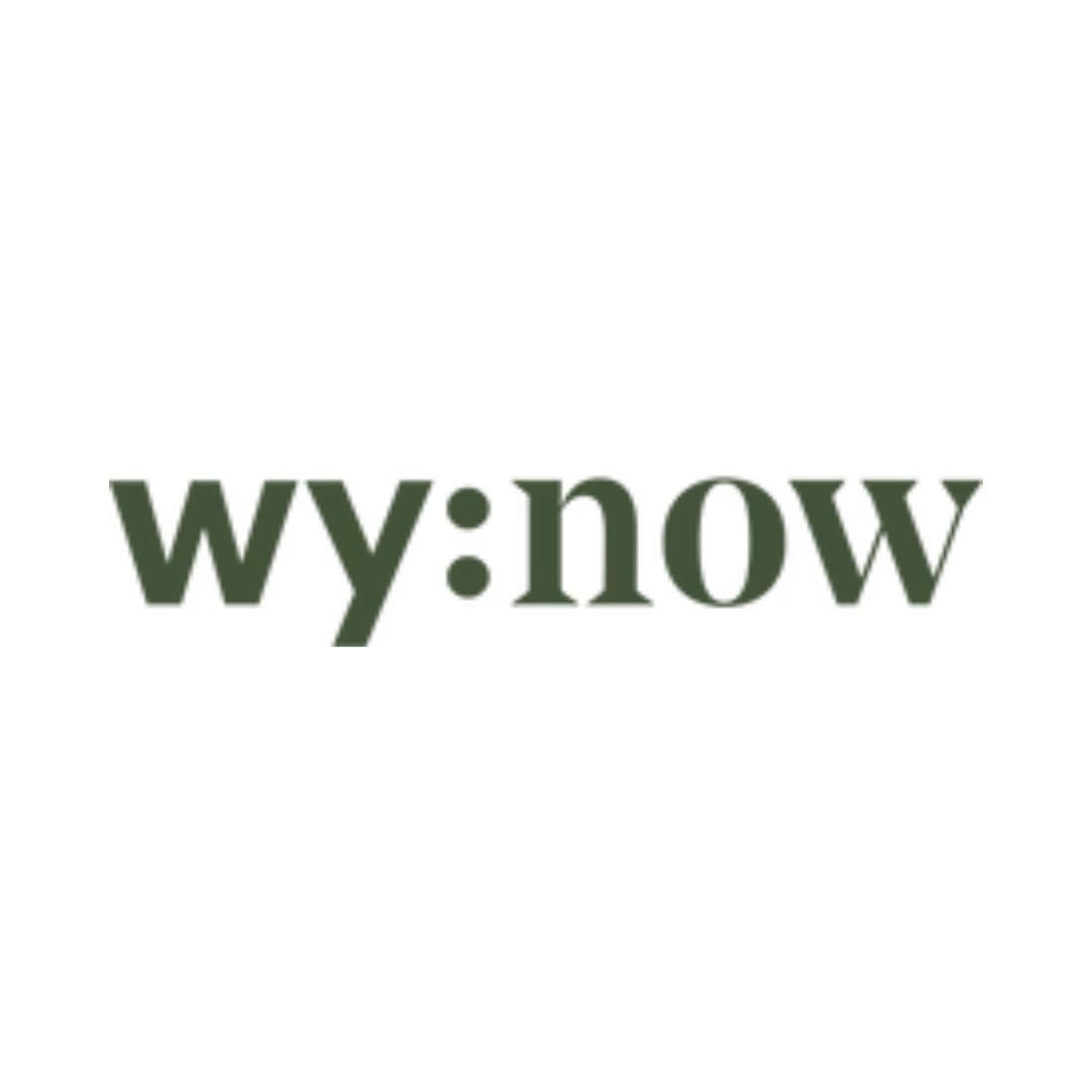 Text logo saying 'wy:now' in dark green font on a white background.
