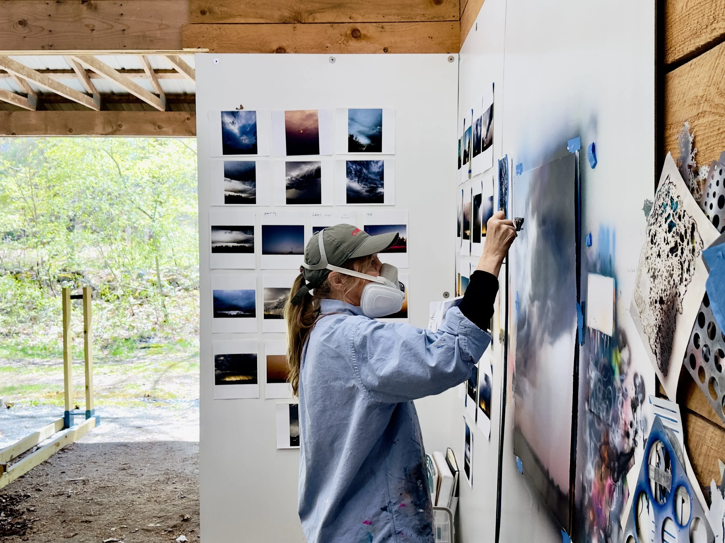 Artist-In-Residence Samantha Fields painting in studio.