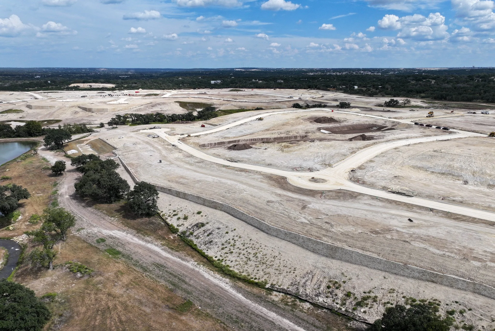 Drone-based site progress reporting imagery documenting construction activity and project advancement.