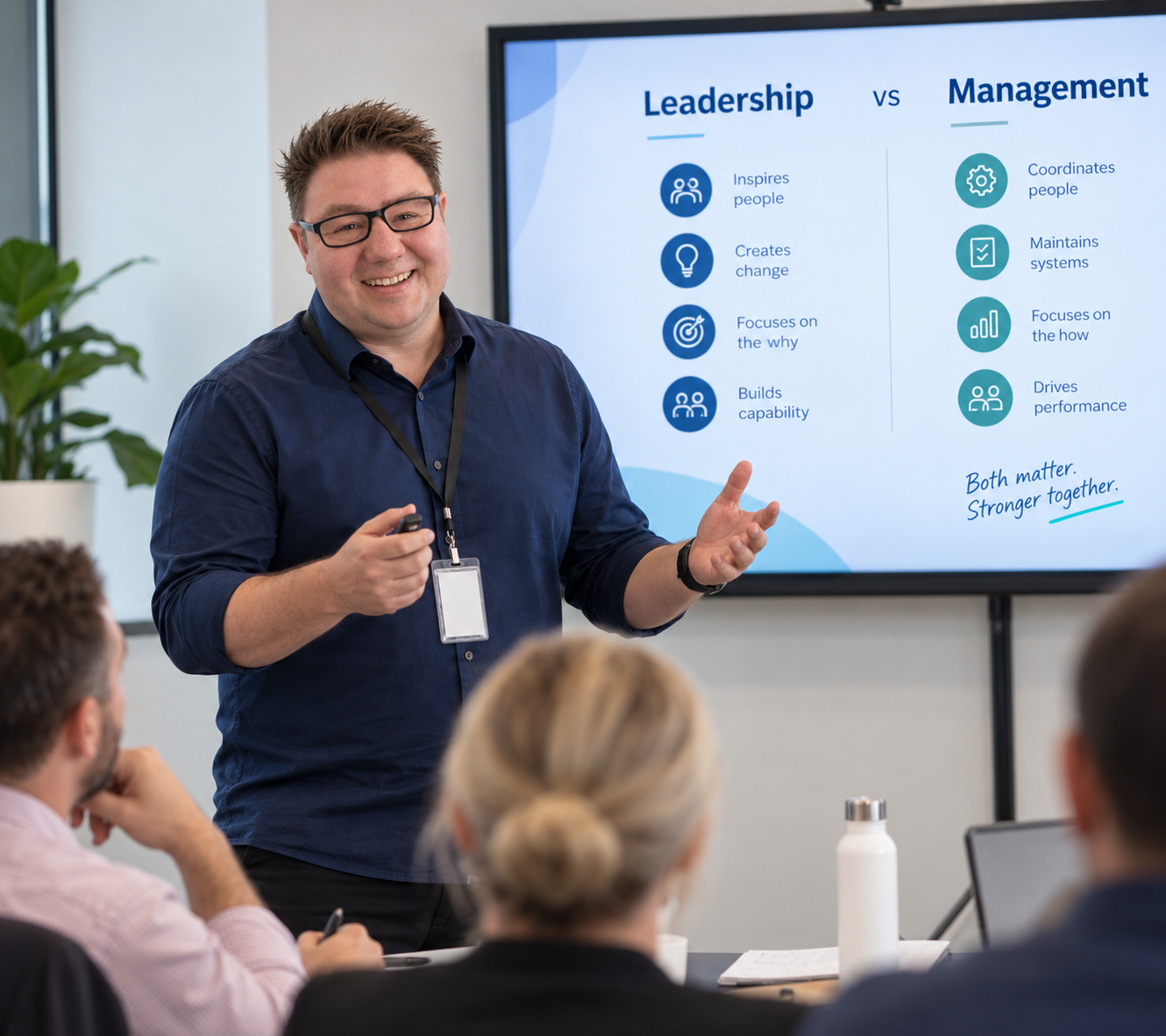 image of callum hosking presenting to a group of managers about leadership training.