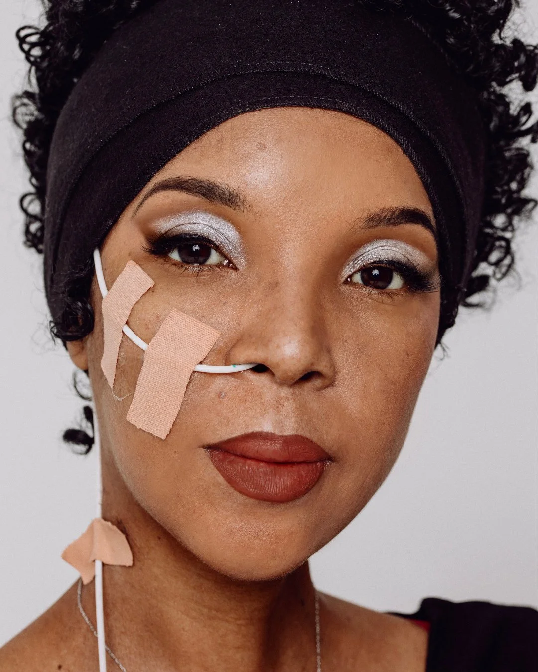 Human Beauty @humanbeautyldn is one of the few makeup brands showcasing models with feeding tubes. In a past campaign, @fordtography captured Ru B flaunting a metallic silver eye-shadow with an NG tube taped to her cheek. ⁠
⁠
&ldquo;It was a non-nego