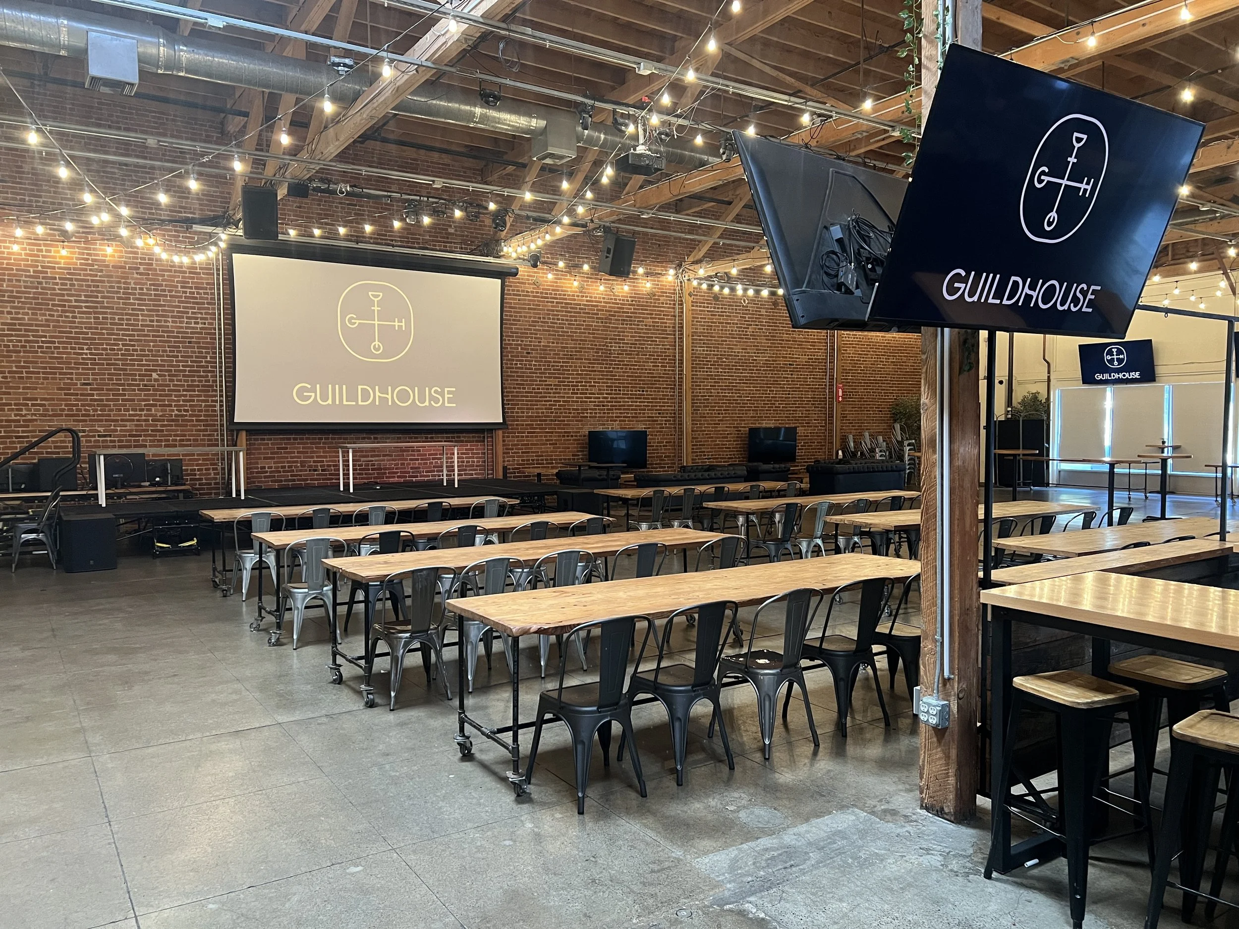 Guildhouse arranged in a classroom-style setup for an offsite workshop for a tech company.