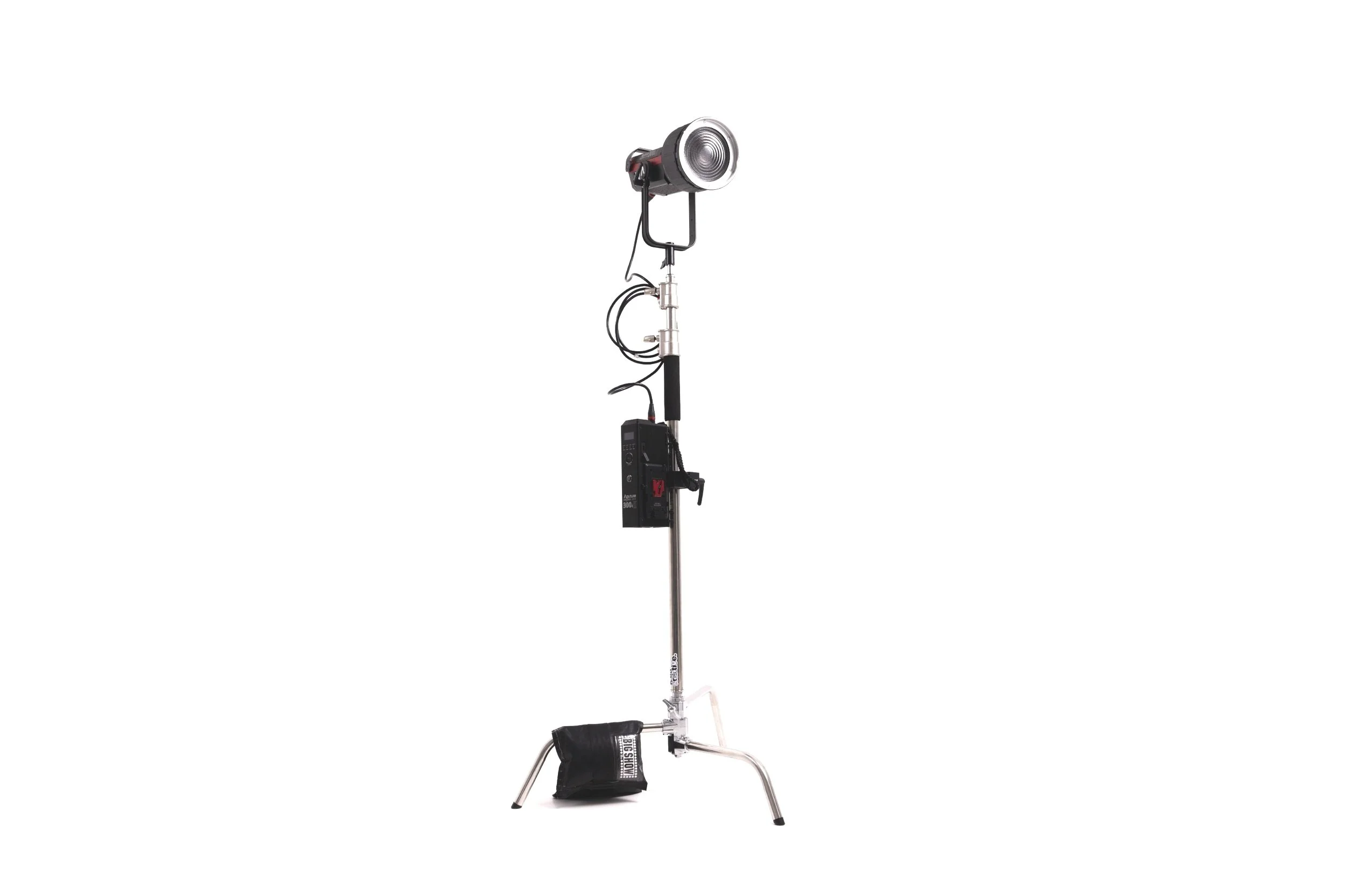 Studio key light on a stand with attached power pack against a white background.