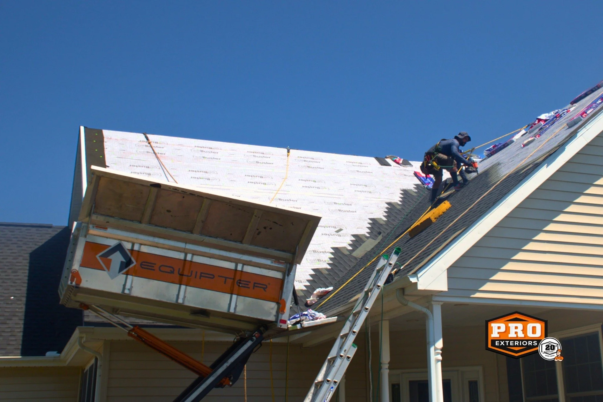 Keeping your property clean during a roofing project is a top priority for us! That's why our crews use the Equipter, a specialized piece of equipment that allows us to remove old roofing materials and debris directly from the roof. This means a clea