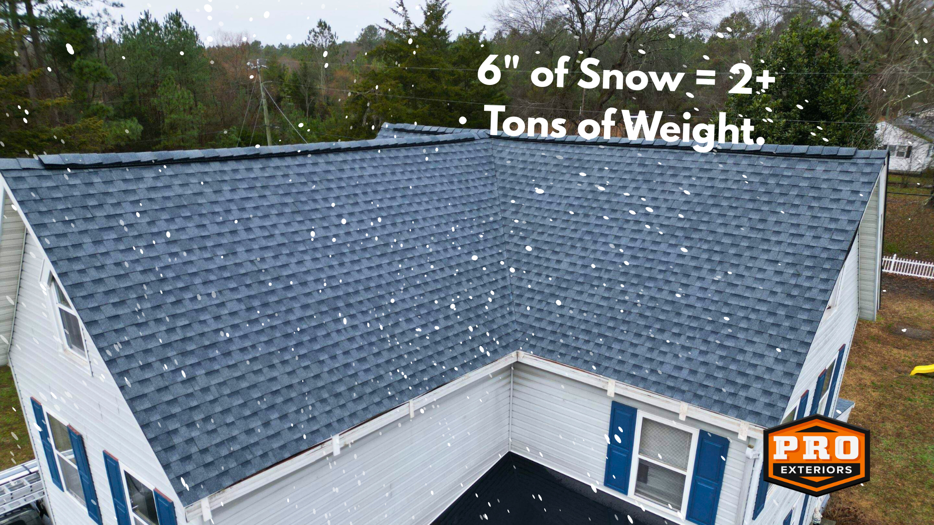 GAF asphalt shingle roof from above with white snowflakes coming down